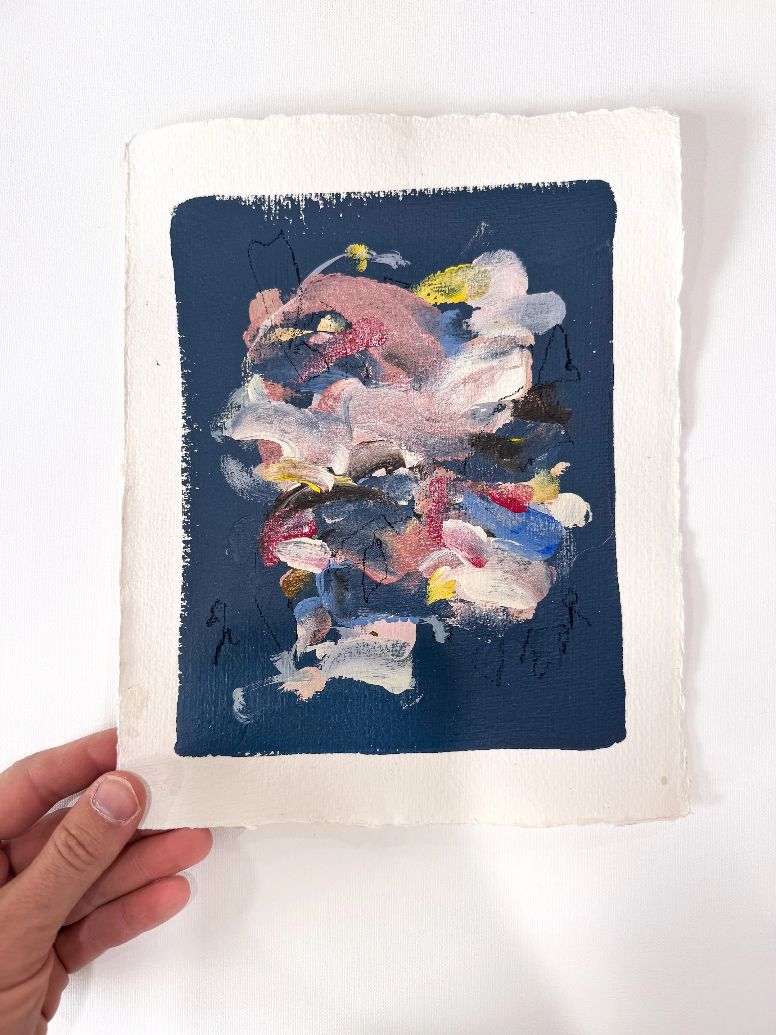 Small original abstract painting on handmade paper with navy blue background and multicolor marks