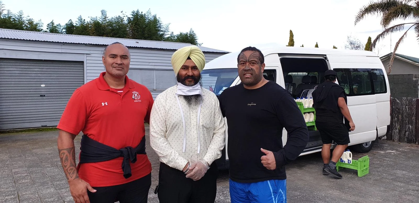 Daljit Singh (in centre) with Taane Tekoi (right), Māori community leader based in Ngaruawahia.
