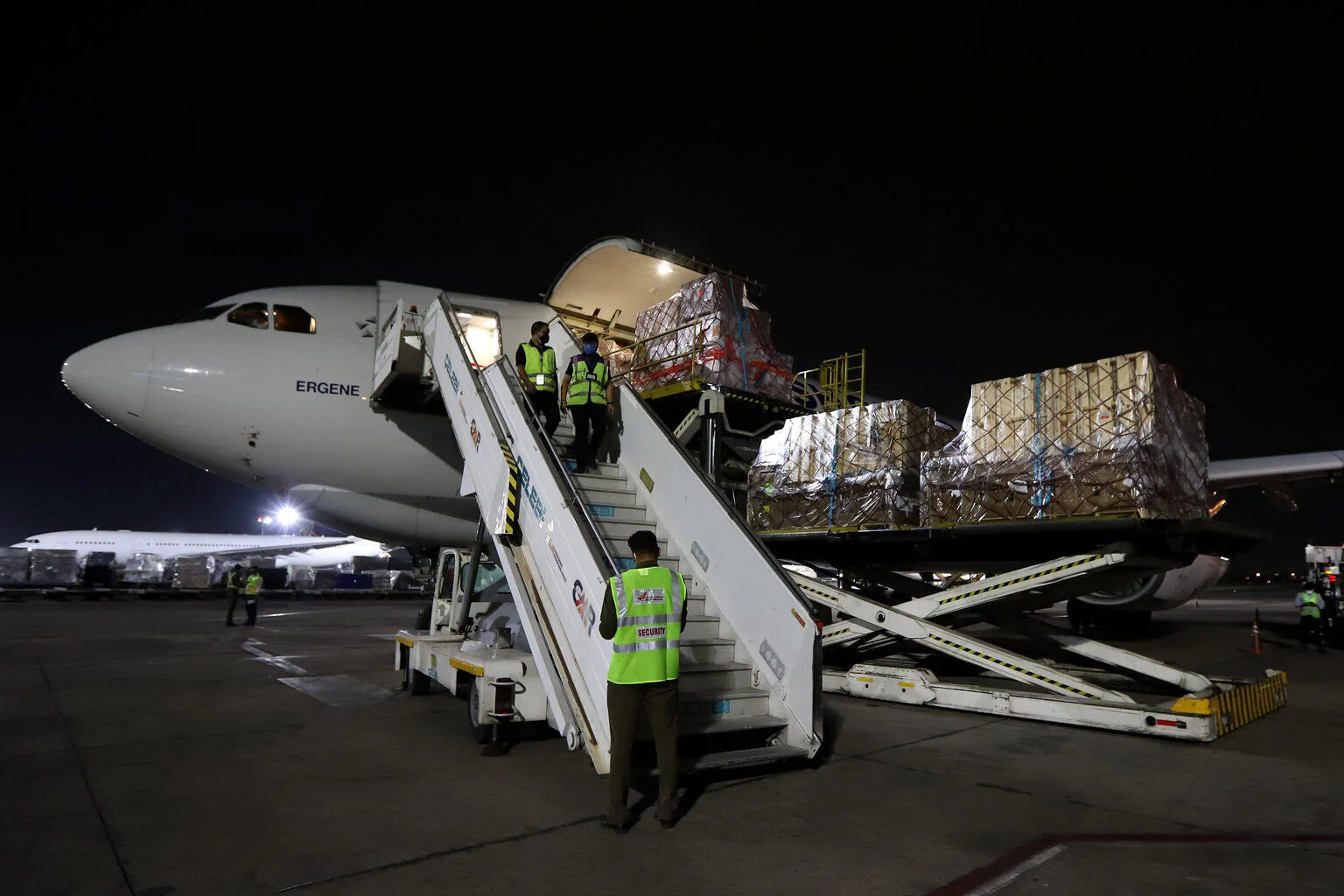 A cargo plane laden with Covid-19 medical supplies sent by UNICEF, is seen on the tarmac upon its arrival at the Indira Gandhi International Airport in New Delhi on May 18, 2021.