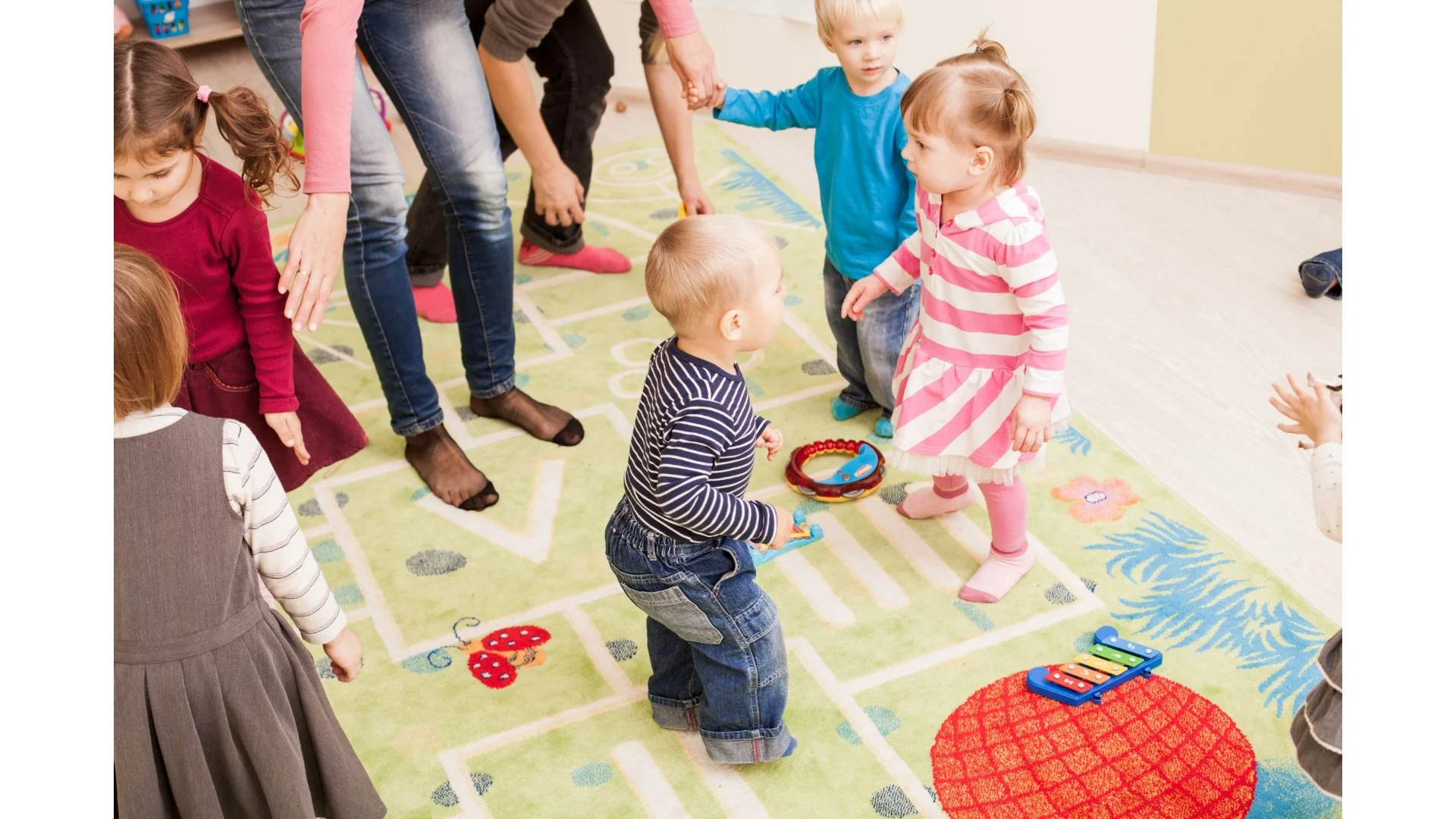 toddlers and babies dancing to music at a playgroup in Windsor