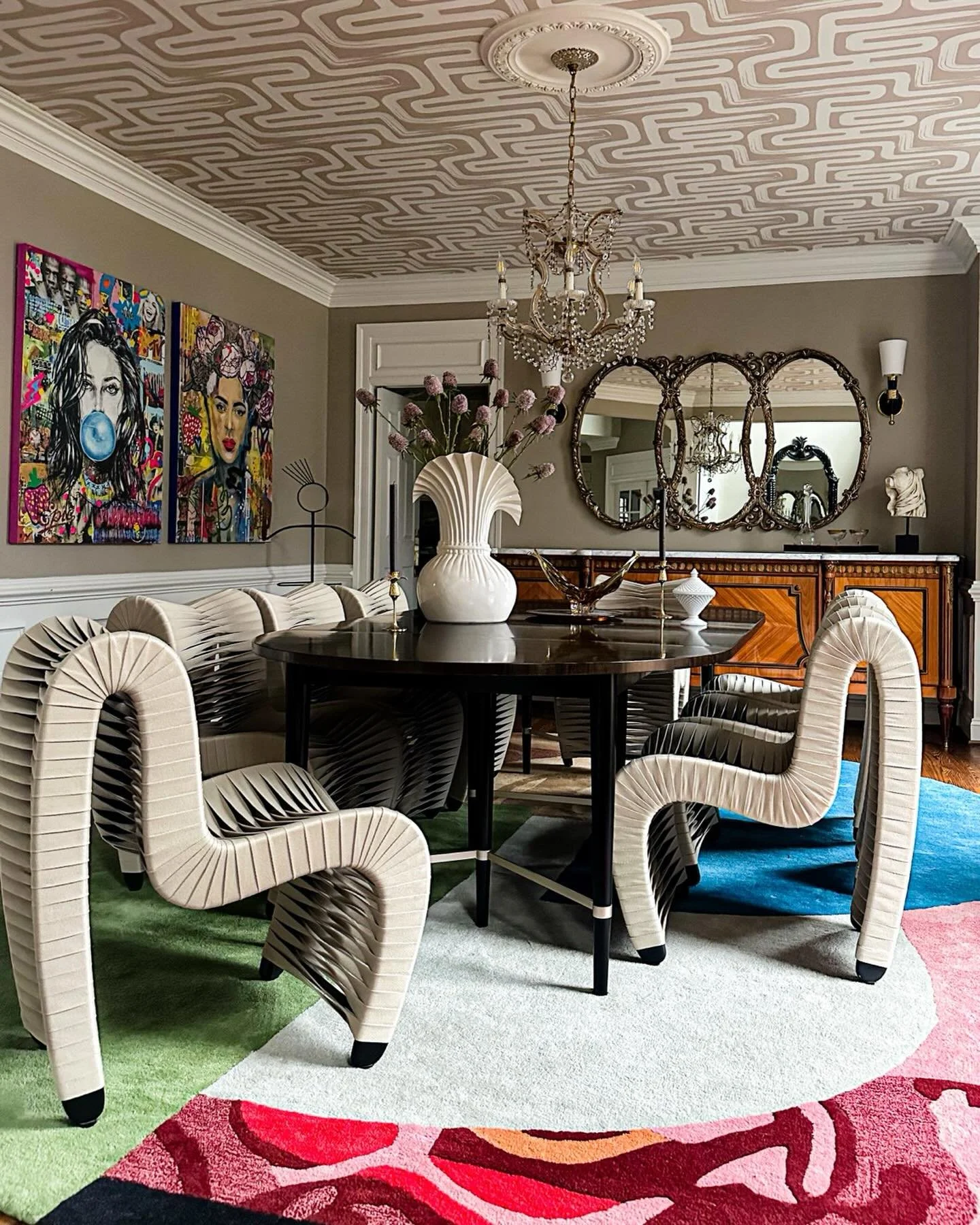 Collected, personal, and meant to be gathered in:

An heirloom chandelier sets the tone beneath an abstract ceiling wallpaper by @livetteswallpaper surrounded by a curated mix of antique, vintage, and modern pieces&mdash;all grounded by a colorful ru