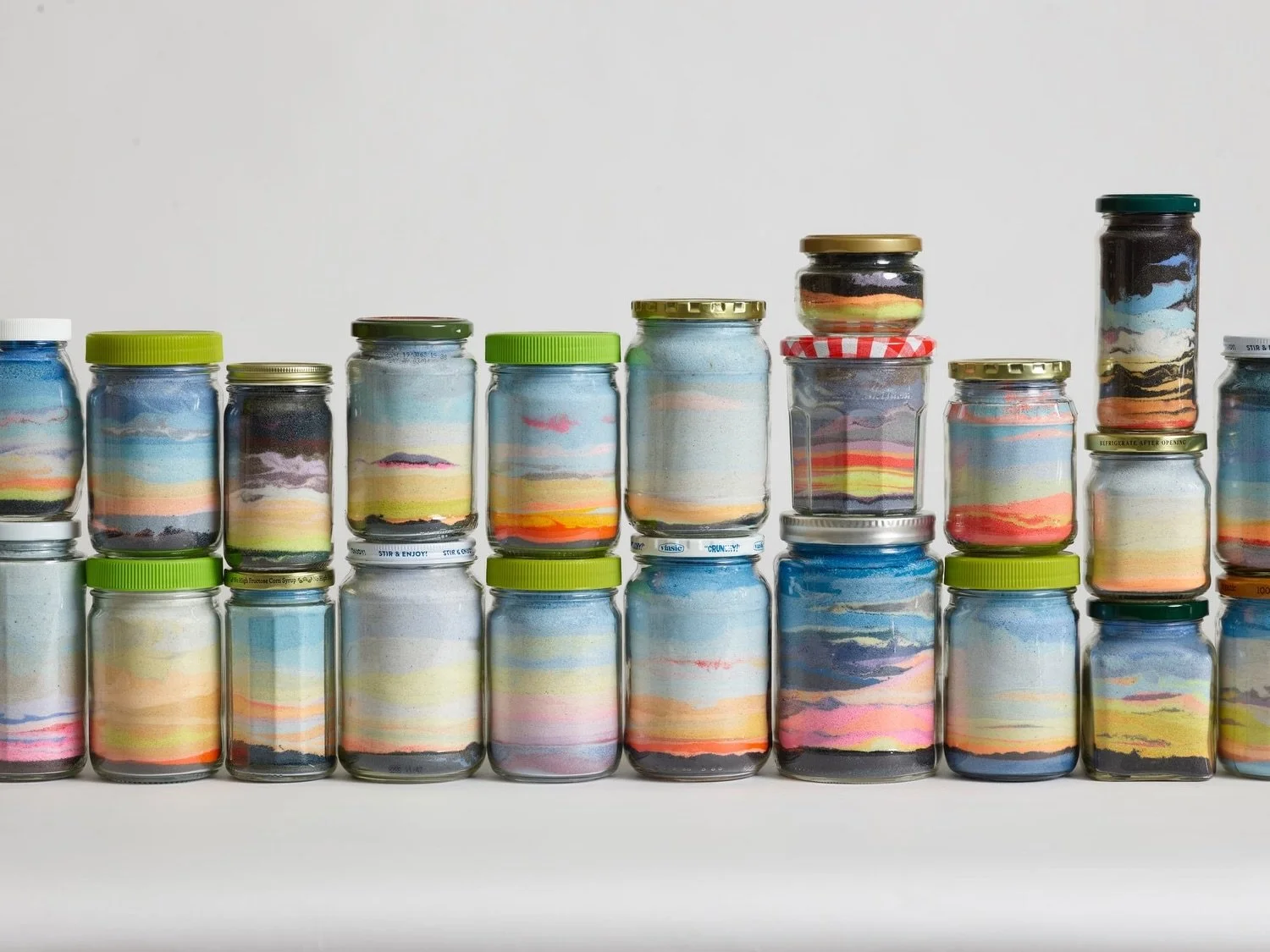 Carly Glovinski's "Canning the Sunset" is one of the nature-inspired works in my new show FLOAT at @fortpointartscommunity Art Space on Sleeper Street in Boston. 🌅

Painted sand and jarred light meet aerial sculptures and transporting oil 