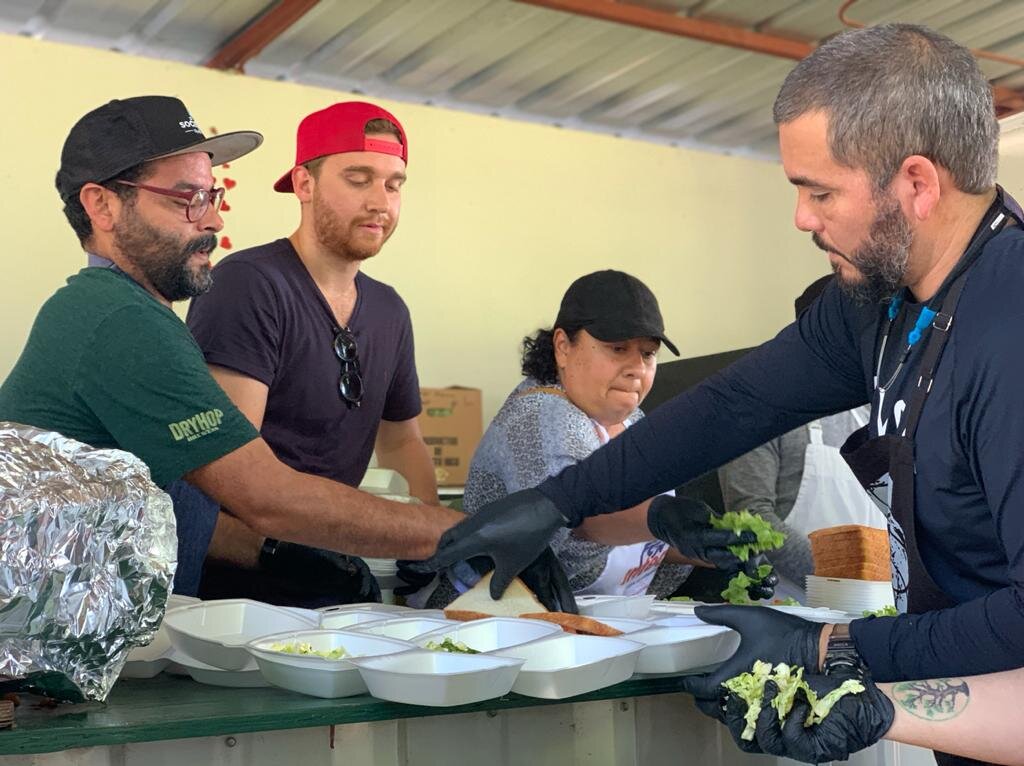 Chefs serving meals to victims of the earthquakes in Puerto Rico