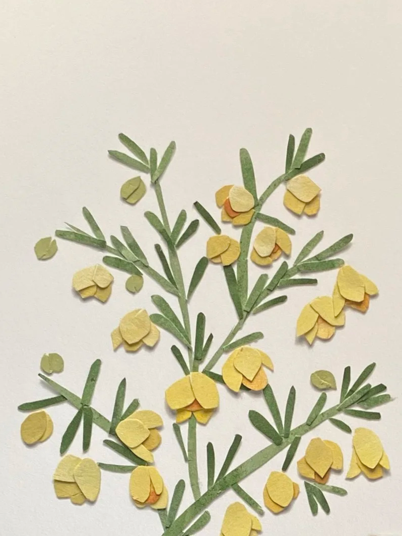 Paper craft of yellow flowers and green leaves on white background.
