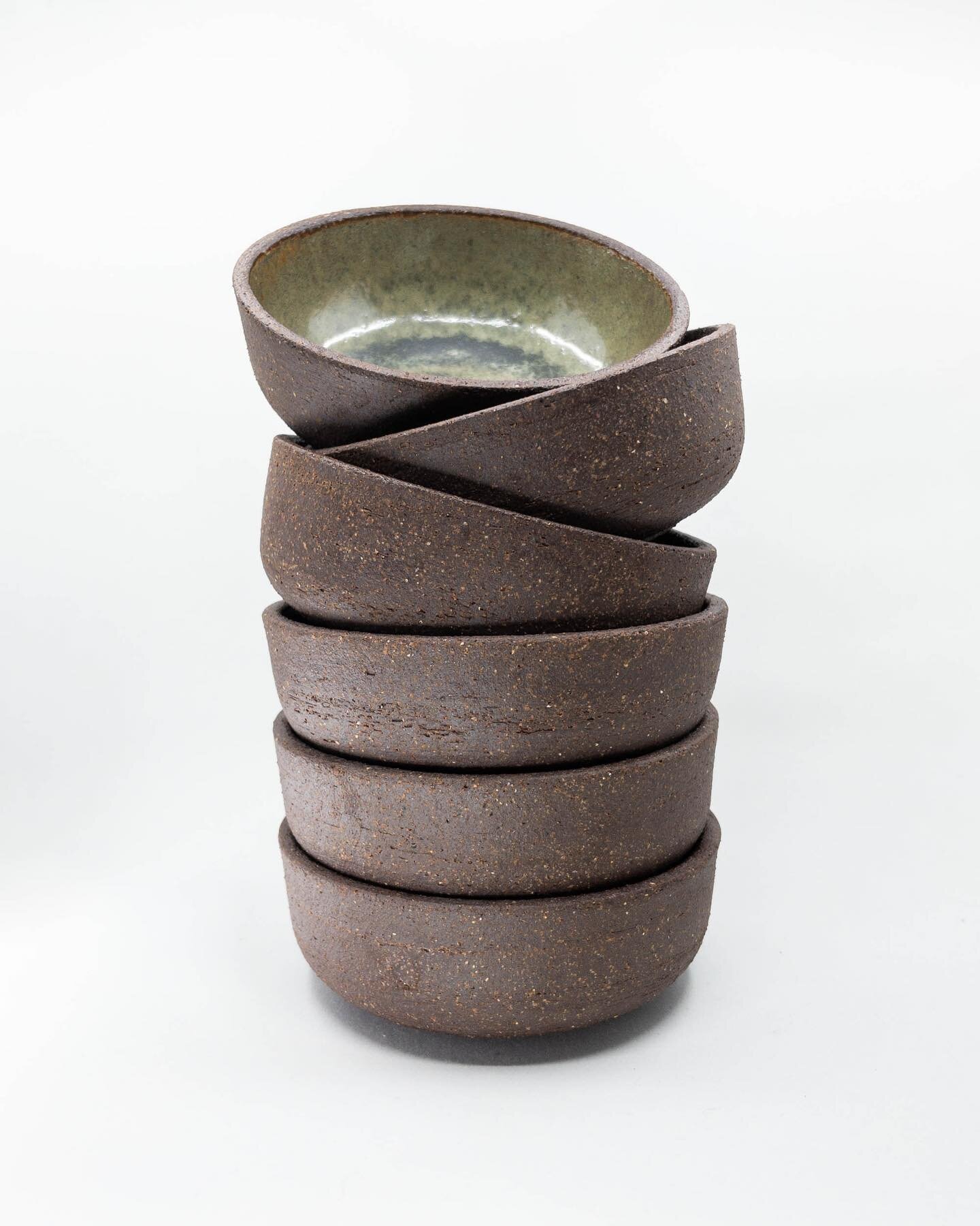 Set of 6 small bowls. Made from red  stoneware with a green glaze on the interior surfaces, reduction fired to cone 10. They shrunk a little more than I expected, but this felt like a bit of a breakthrough for me in terms of throwing a relatively con