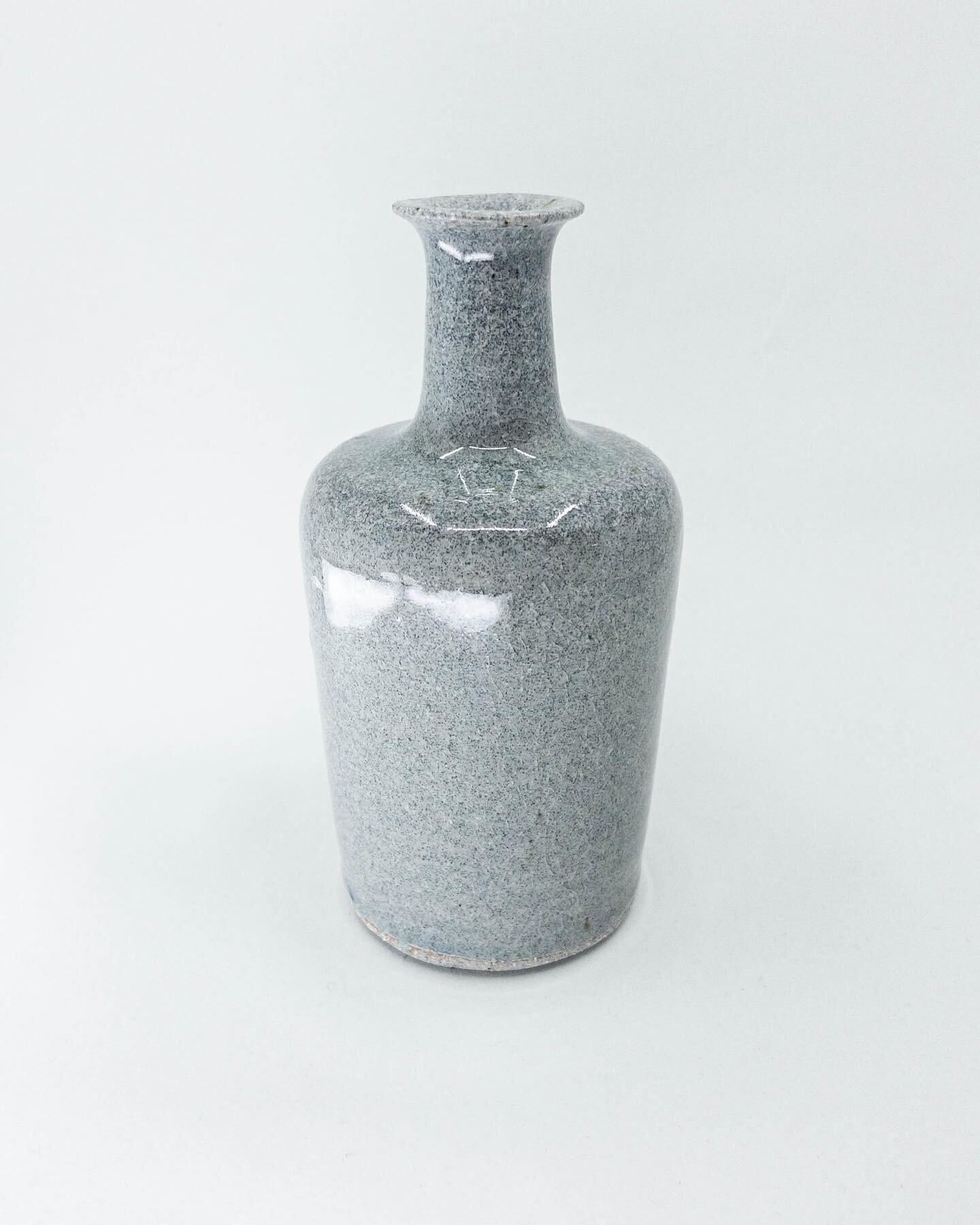 Grey bottle. Made from &ldquo;granite&rdquo; stoneware with a clear glaze, reduction fired to cone 10. Probably the most bottle-ey bottle I&rsquo;ve bottled. I love this clay+glaze combo and the way it looks like polished concrete when finished. 
.
.