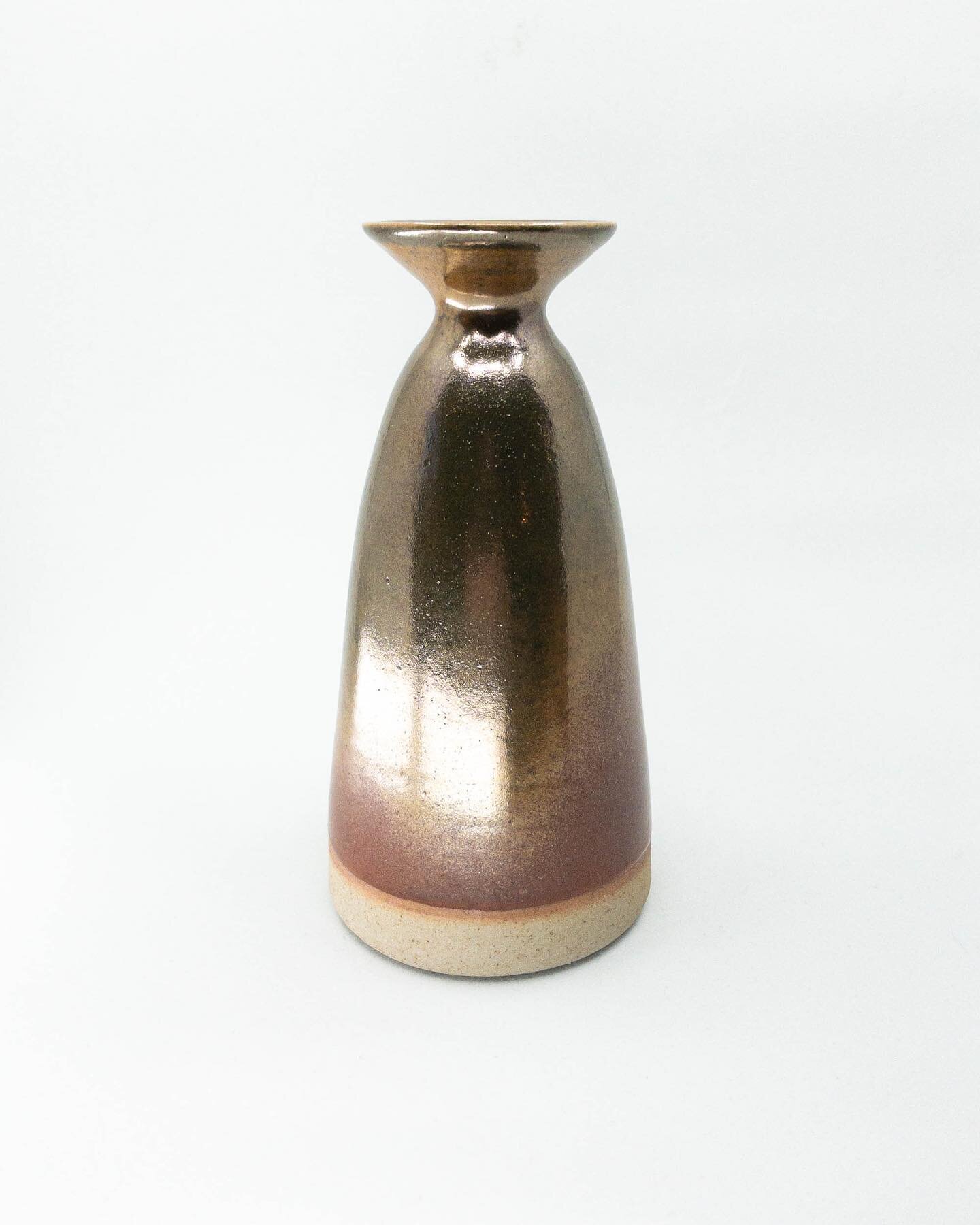 Mum&rsquo;s Vase. Made from a light stoneware with a metallic gold-red shino glaze, reduction fired to cone 10. So shiny.
.
.
.
.
.
#pottery #ceramics #handmade #vase #reductionfired #wheelthrown #clay #stoneware #wheelthrownceramics #metallic #shiny