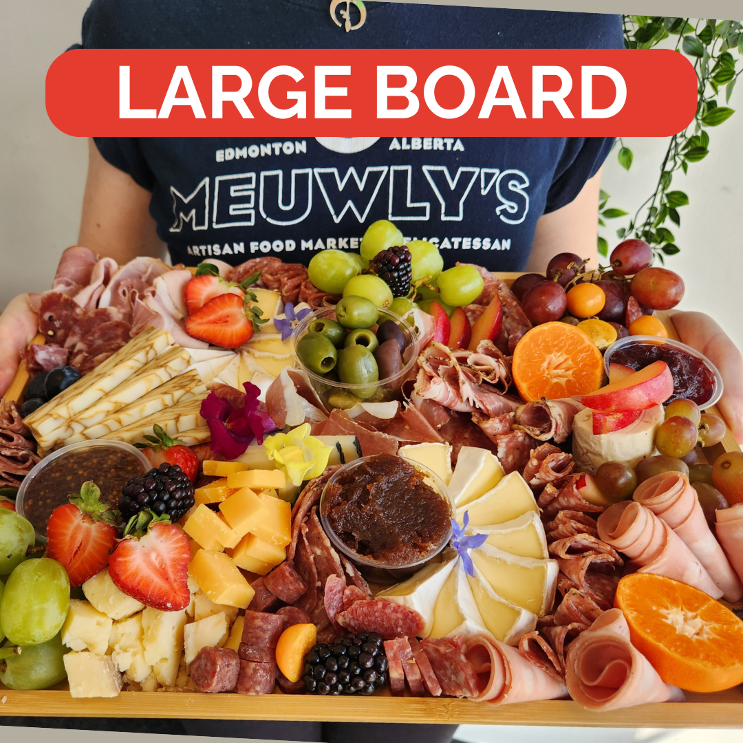 Gourmet charcuterie board from Meuwly's in Edmonton, featuring cured meats, artisan cheese, and more