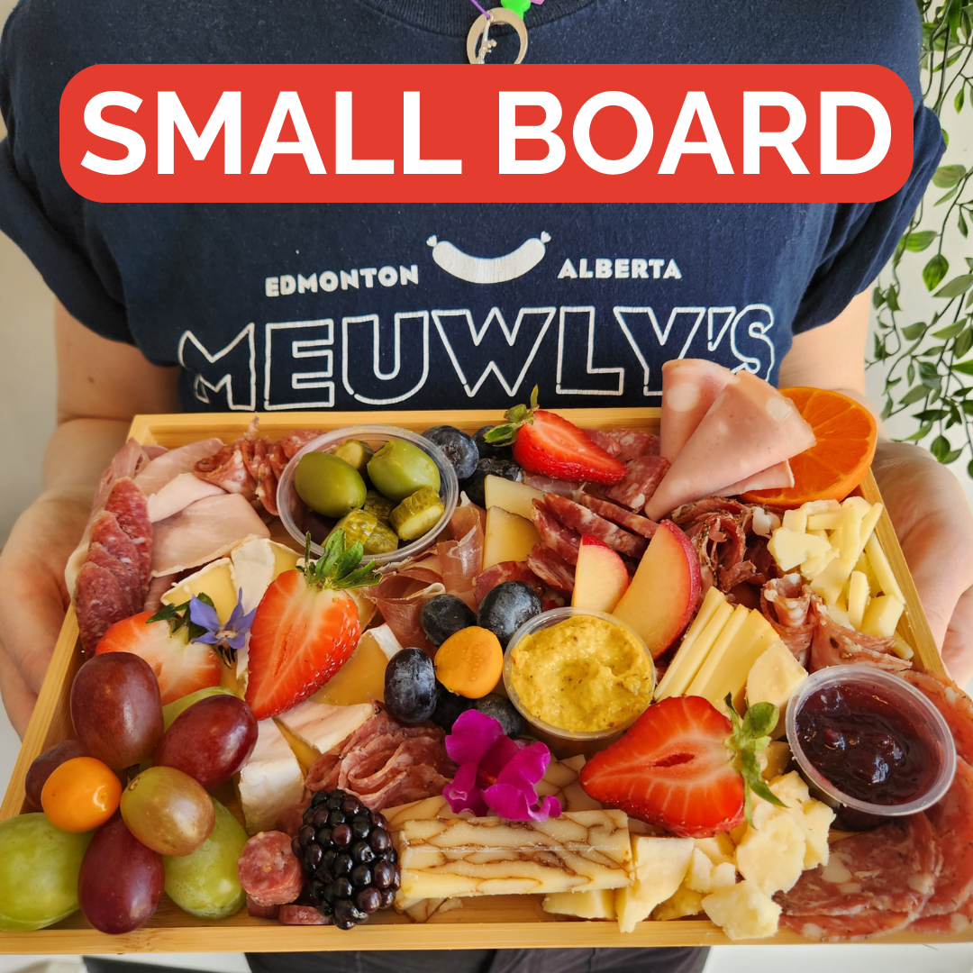 Gourmet charcuterie board from Meuwly's in Edmonton, featuring cured meats, artisan cheese, and more