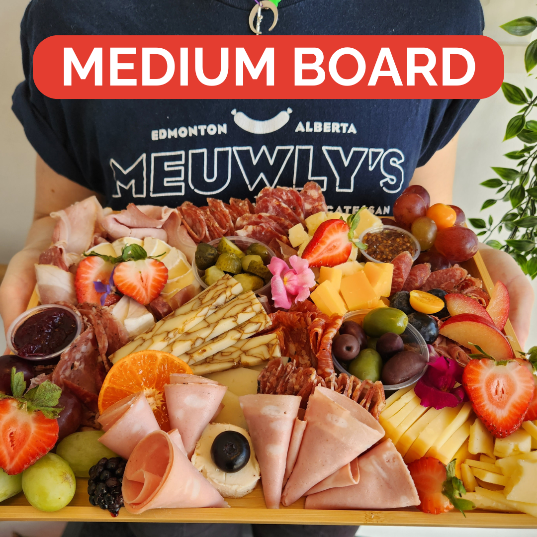 Gourmet charcuterie board from Meuwly's in Edmonton, featuring cured meats, artisan cheese, and more