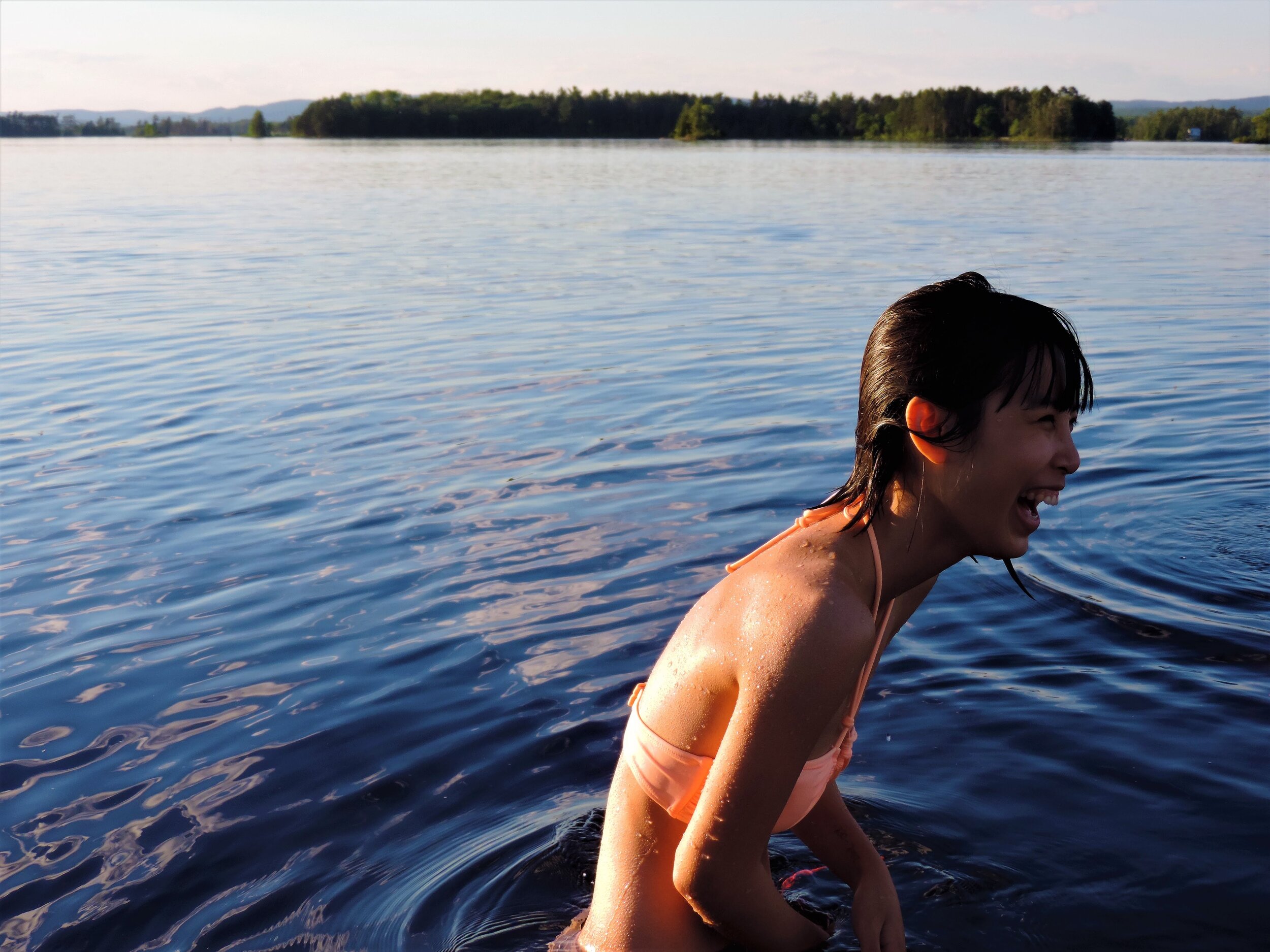 Taken at the beginning of July. My sister asked me to take pictures of her but every single one had been too staged. I hid my camera from her but then someone tossed her in the water and her face light up when she resurfaced.