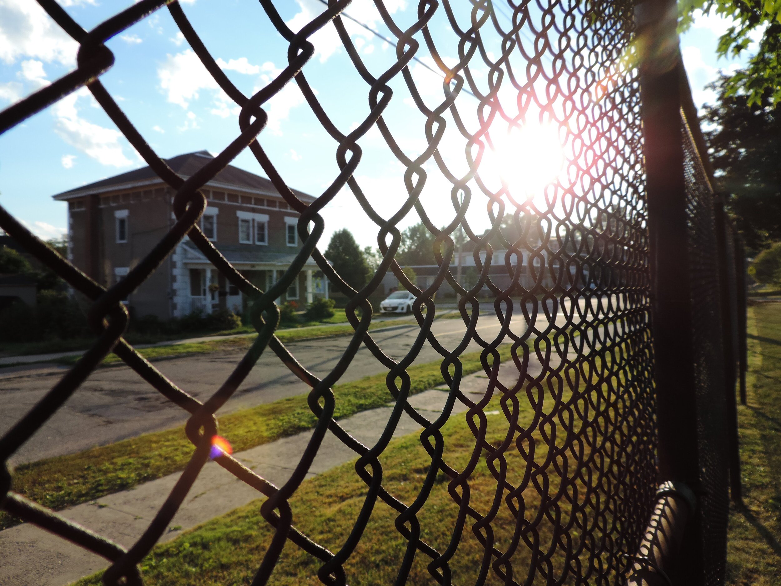 Every Saturday morning I would go to the park situated across the street from my house. It was a routine I had gotten used to and the fence became a barrier separating me from everything else.