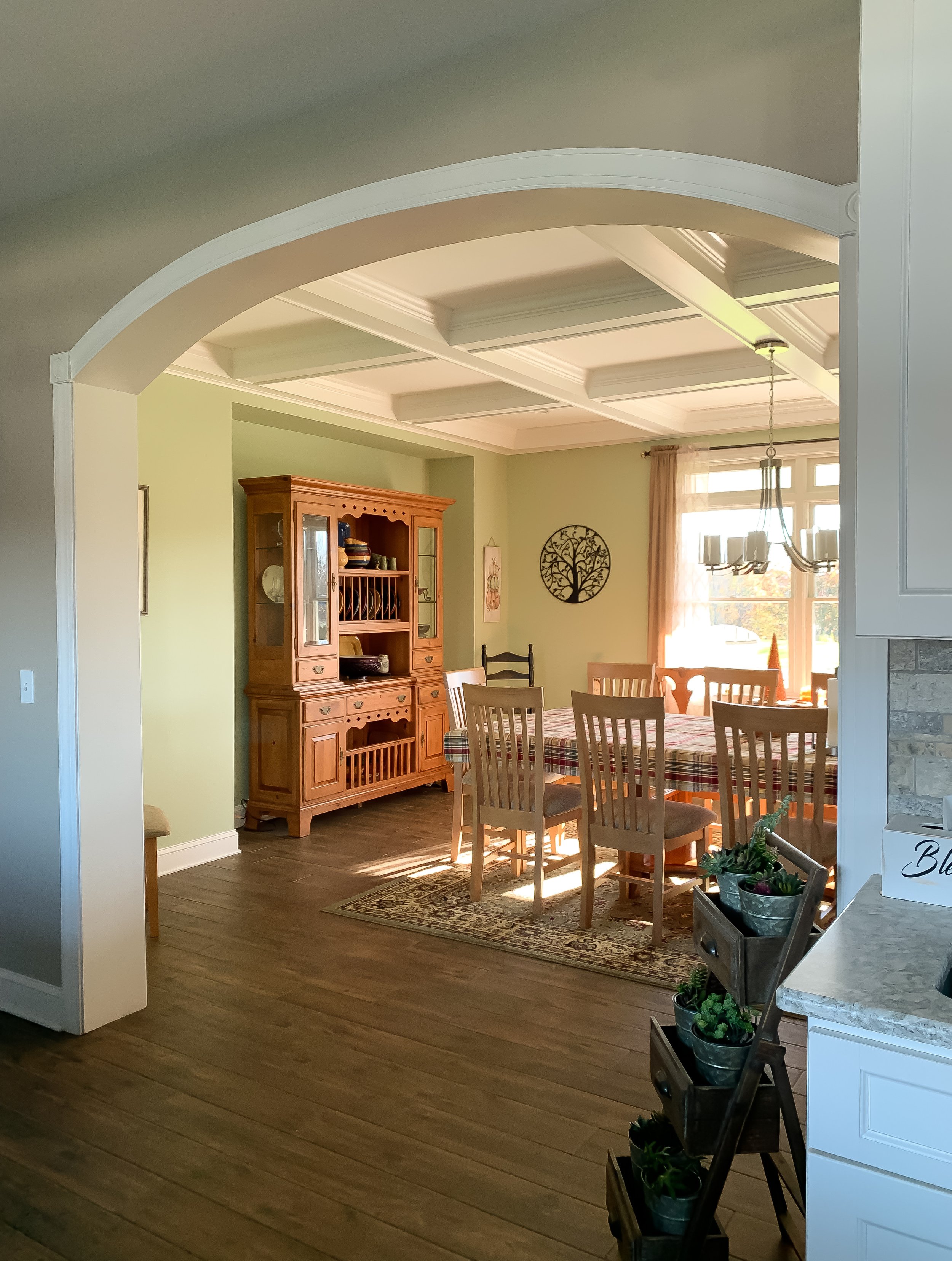 Dining room adjacent to kitchen with arched entryway.JPEG