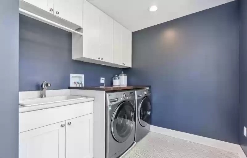 Laundry room in prefab new jersey house signature building systems.jpg