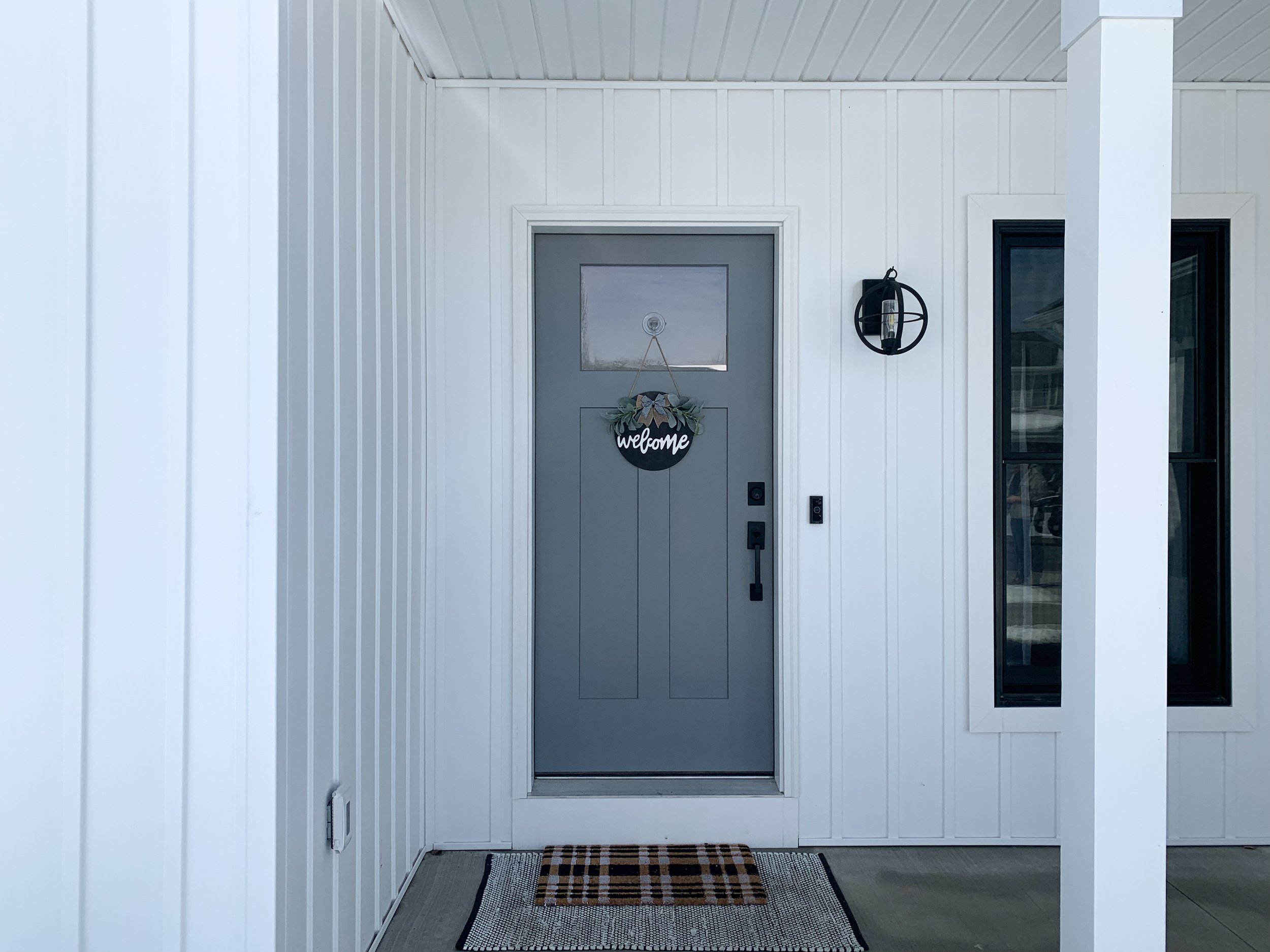Modular Modern Farmhouse Ranch front porch grey door.JPEG