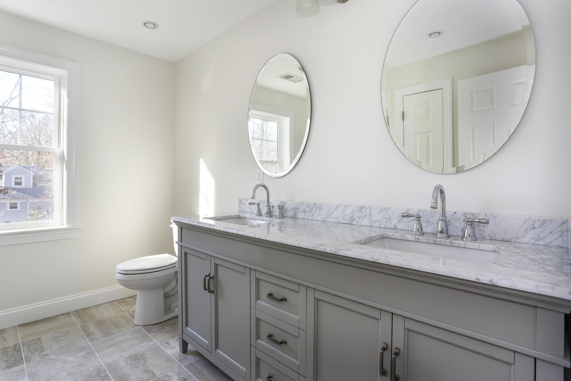 Double sink marble countertops and square sink basins.jpeg