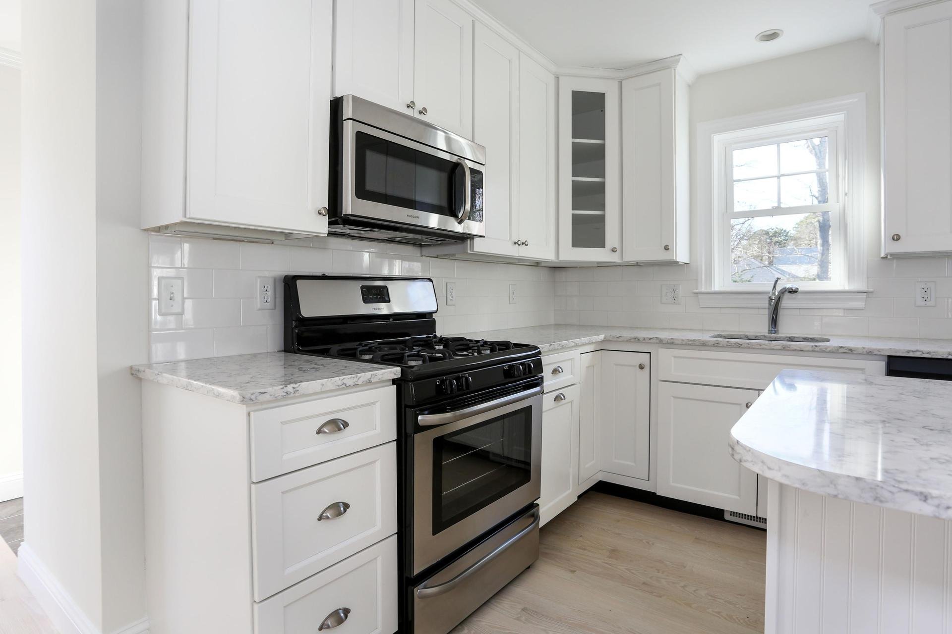 White kitchen with granite countertops.jpeg
