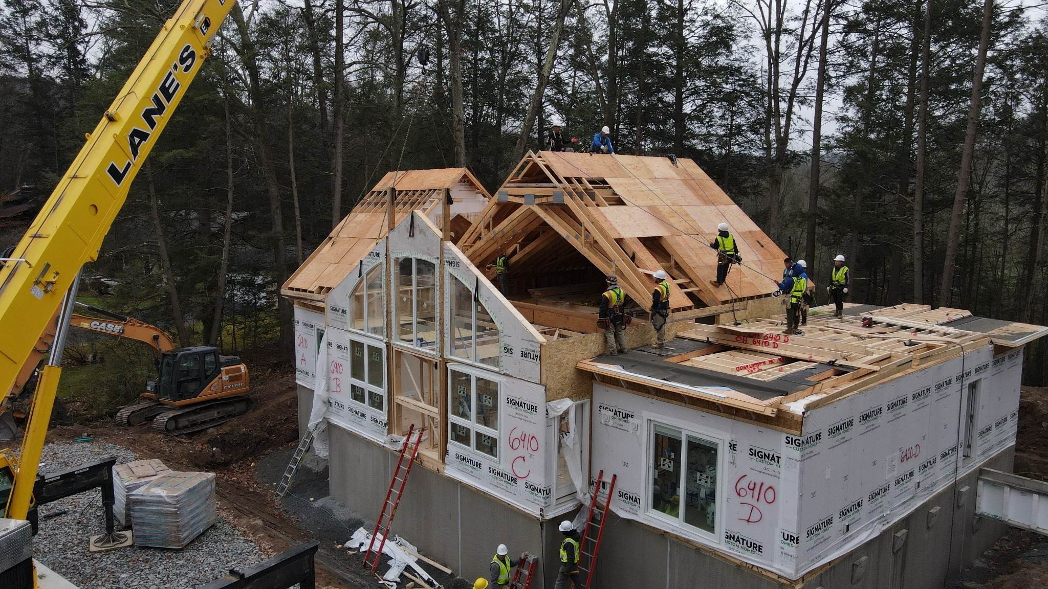 Installation of Roof Panels on a custom modular cape style home