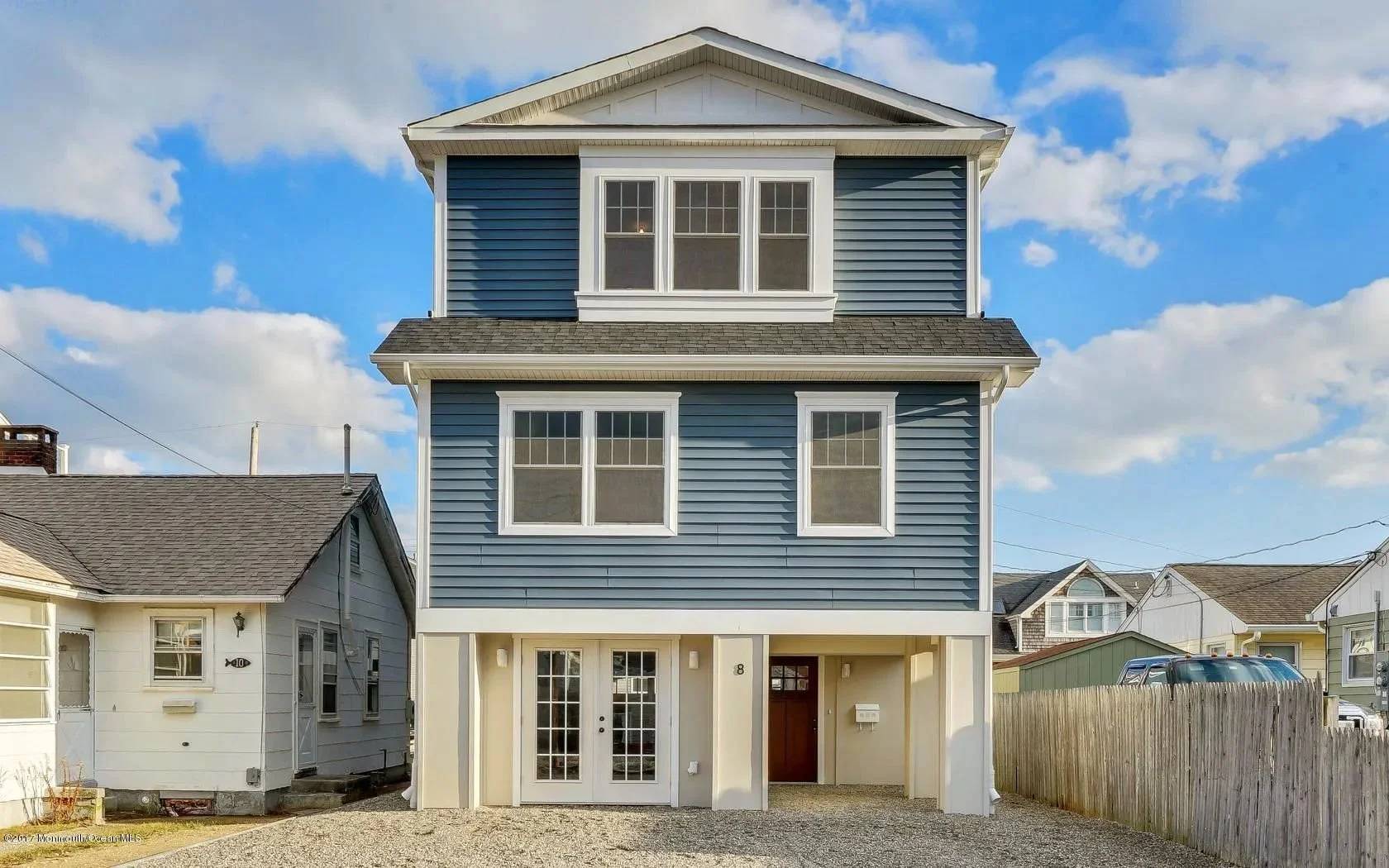 Exterior view of modular coastal home in Monmouth County, NJ with front deck