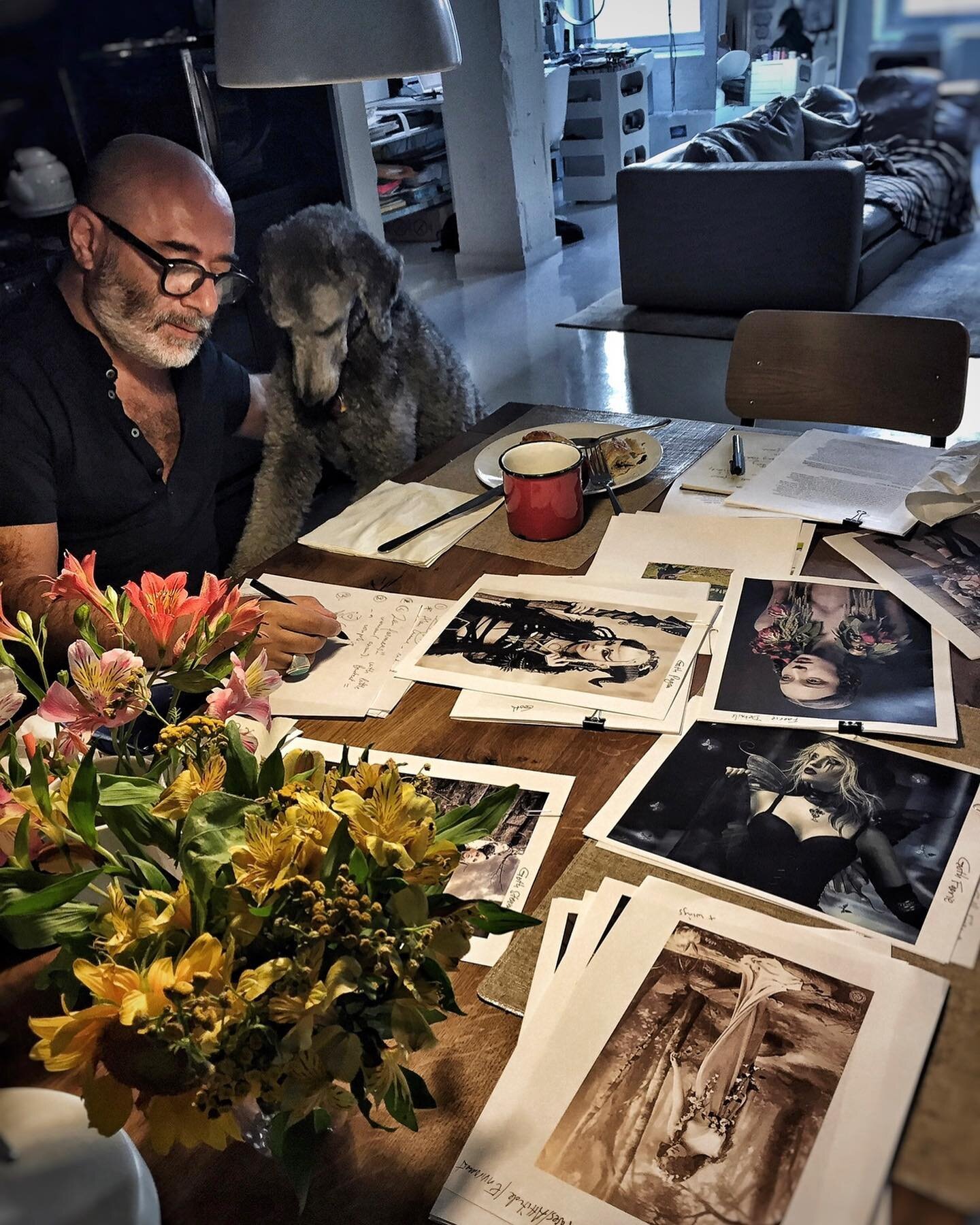 Manifesto artist @izakzenou_illustrationist (with inspirational images) sketching while Wooly looks on. From our archives.