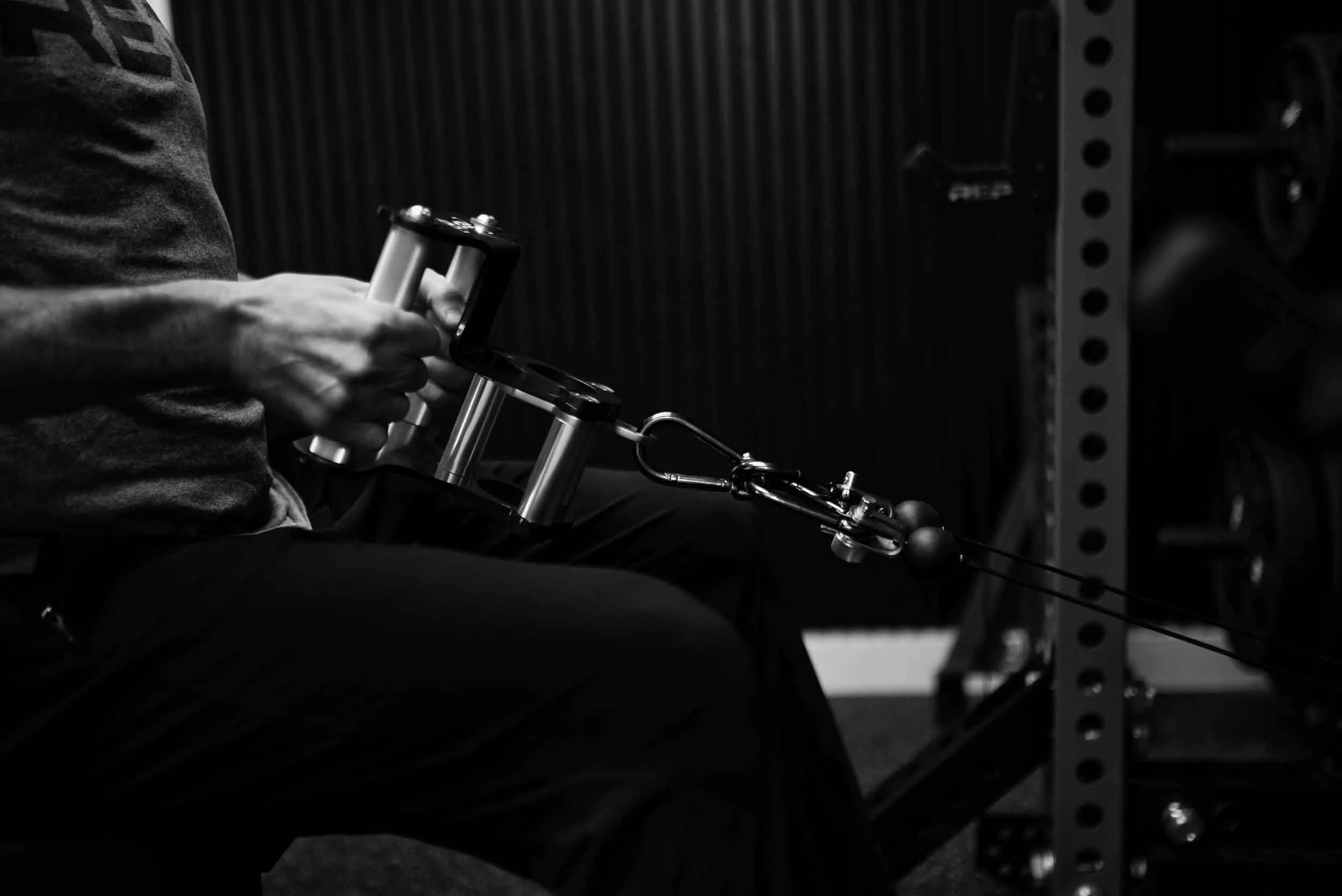 a pair of arms doing fitness exercises inside a durango gym
