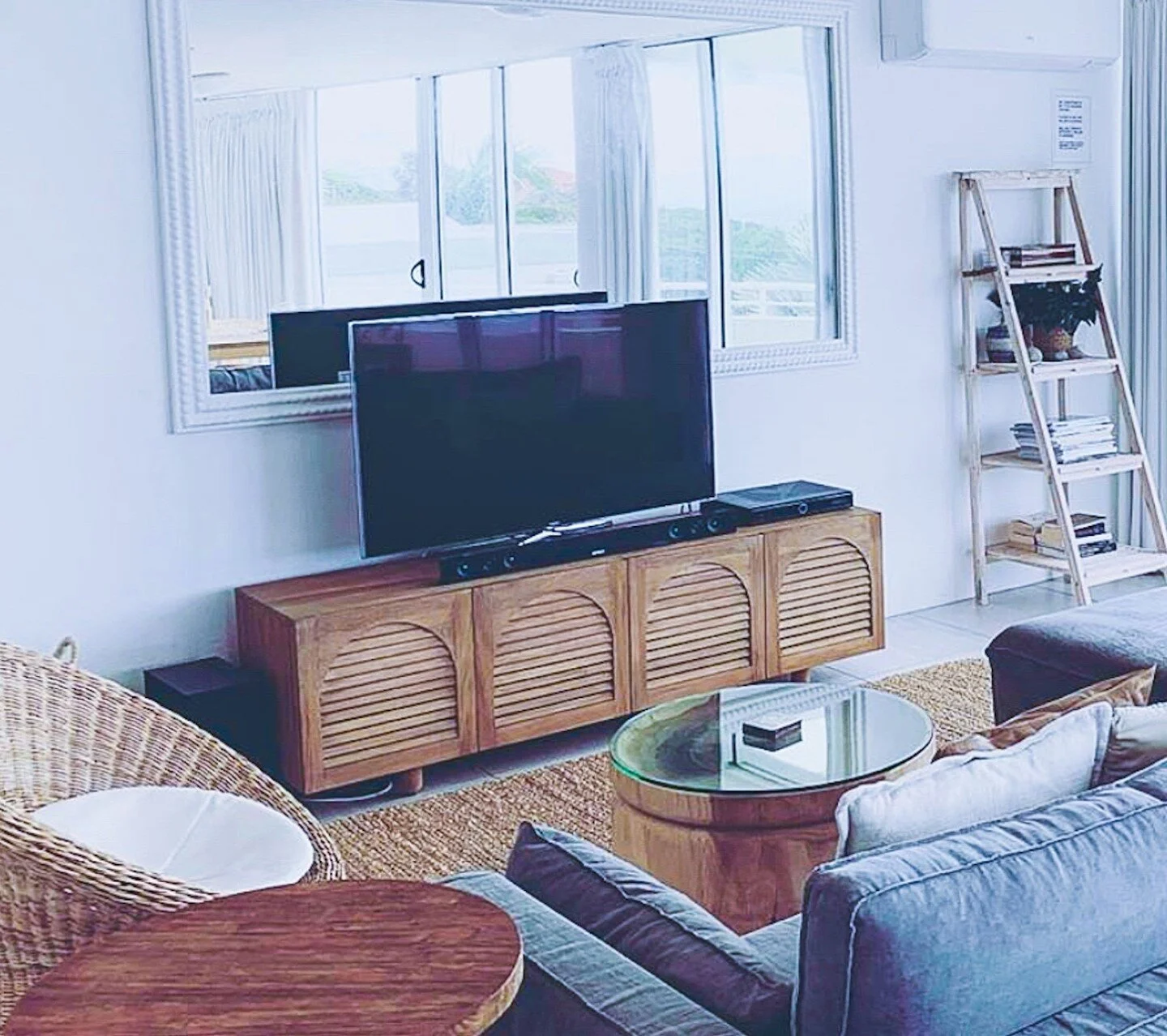 //CASUAL STORAGE STYLE// sometimes a design calls for furniture storage, like this beautiful cabinet @globewest The arch detailing with the timber slats + the ladder style shelving add character + warmth to this coastal living room.⁠
⁠
⭐DESIGNER TIP⭐ Consider all the elements in the room + check the proportions, colour, materials, pattern + other detailing in the furniture storage pieces to find just the piece that will make your room sing. ⁠
.⁠
.⁠
.⁠
⁠
#furniturestorage #furnitureideas #coastaldesign #coastalstyle #naturalmaterials #addcharacter #interiorinspo #interiorideas #livingroomstyle #livingroominspo #coastalliving #coastalloungeroom #globewest