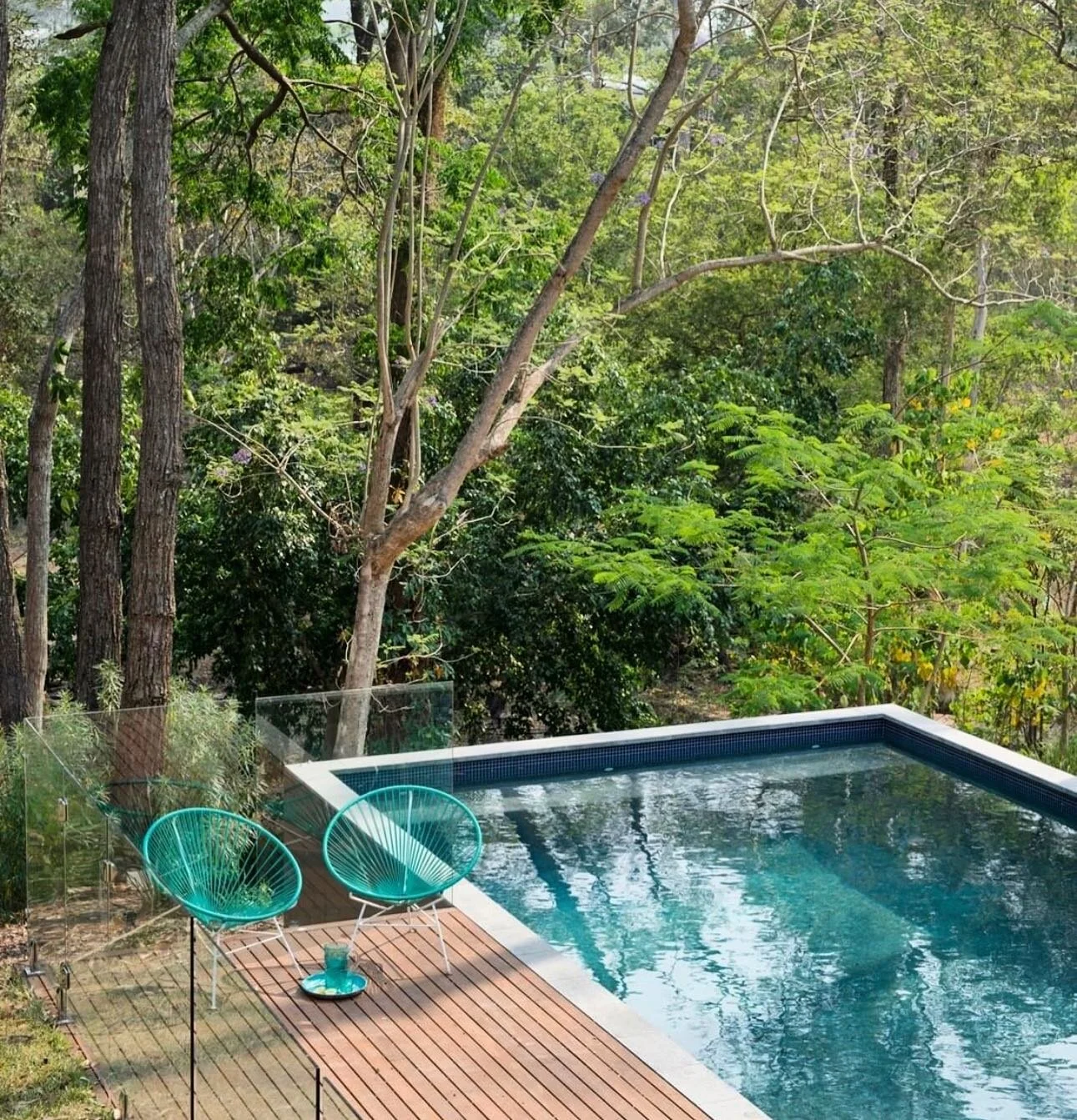 //FEELS LIKE SUMMER ☀️ // Happy Hump Day from where I&rsquo;d rather be today 😎 This pool designed with a more sustainable &amp; easier to maintain &lsquo;infinity edge&rsquo; with a full length seat to sit, solve the problems of the world &amp; take in the bush land view. Happy Summer Days are here
📸 @mindicooke As seen in @thedesignfiles 
#mouldedseating #pooldesign #pooltime #summervibes #summerishere #naturalpool #infinitypool #infinityedge #bushlandsetting #landscapedesign #poolsidevibes #poolcolour #watercolour #waterview #brisbanedesigner #brisbaneanyday #interiordesigner #exteriorpallette #exteriordesign #exteriormaterials #timberdecking #acupulcochair #tilededge #poolseat #designinspiration #inspiredby #glassfence