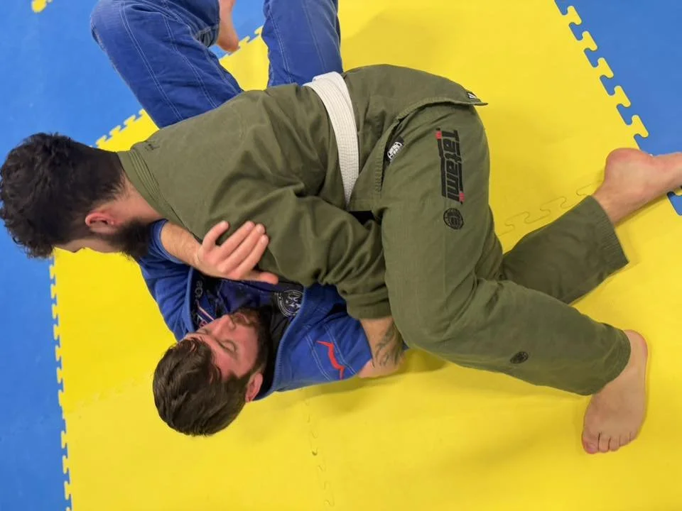 Two men wearing GIs in a SMMA Brazilian Jiu-Jitsu class in Helensburgh