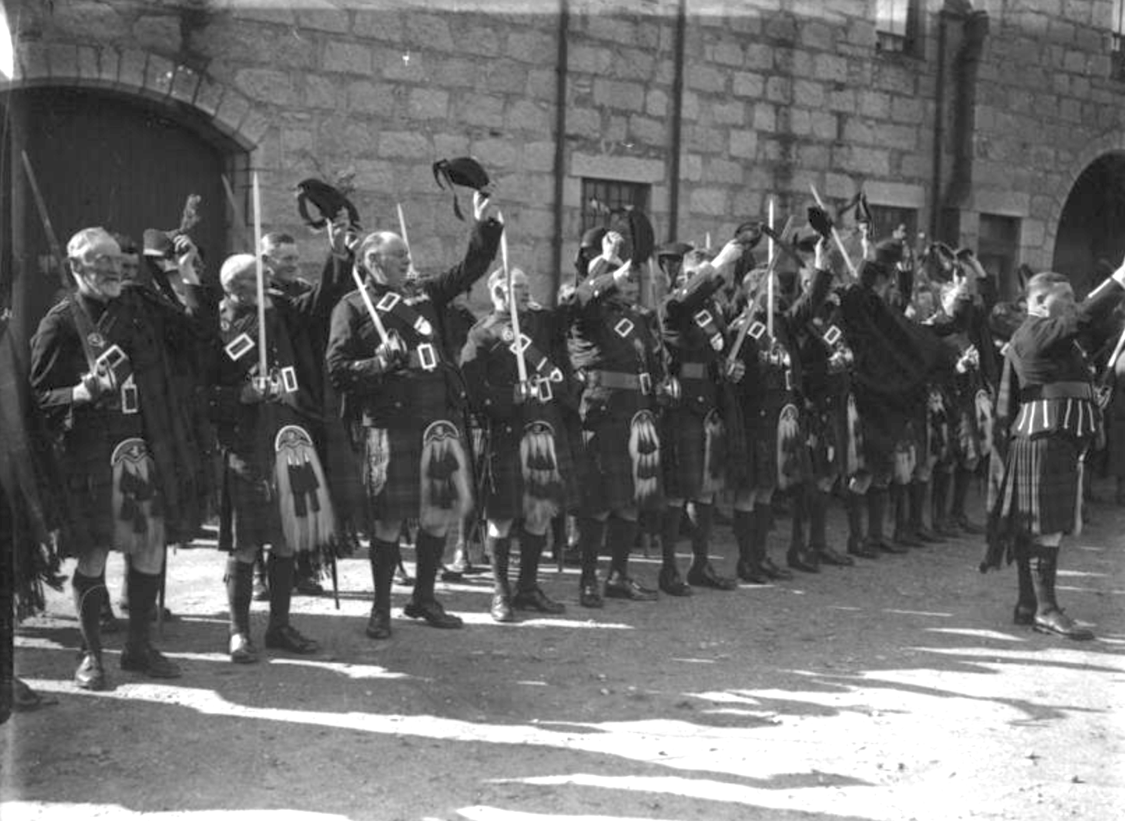 Braemar Gathering. The Invercauld Highlanders raise their broadswords and cheer. 1938