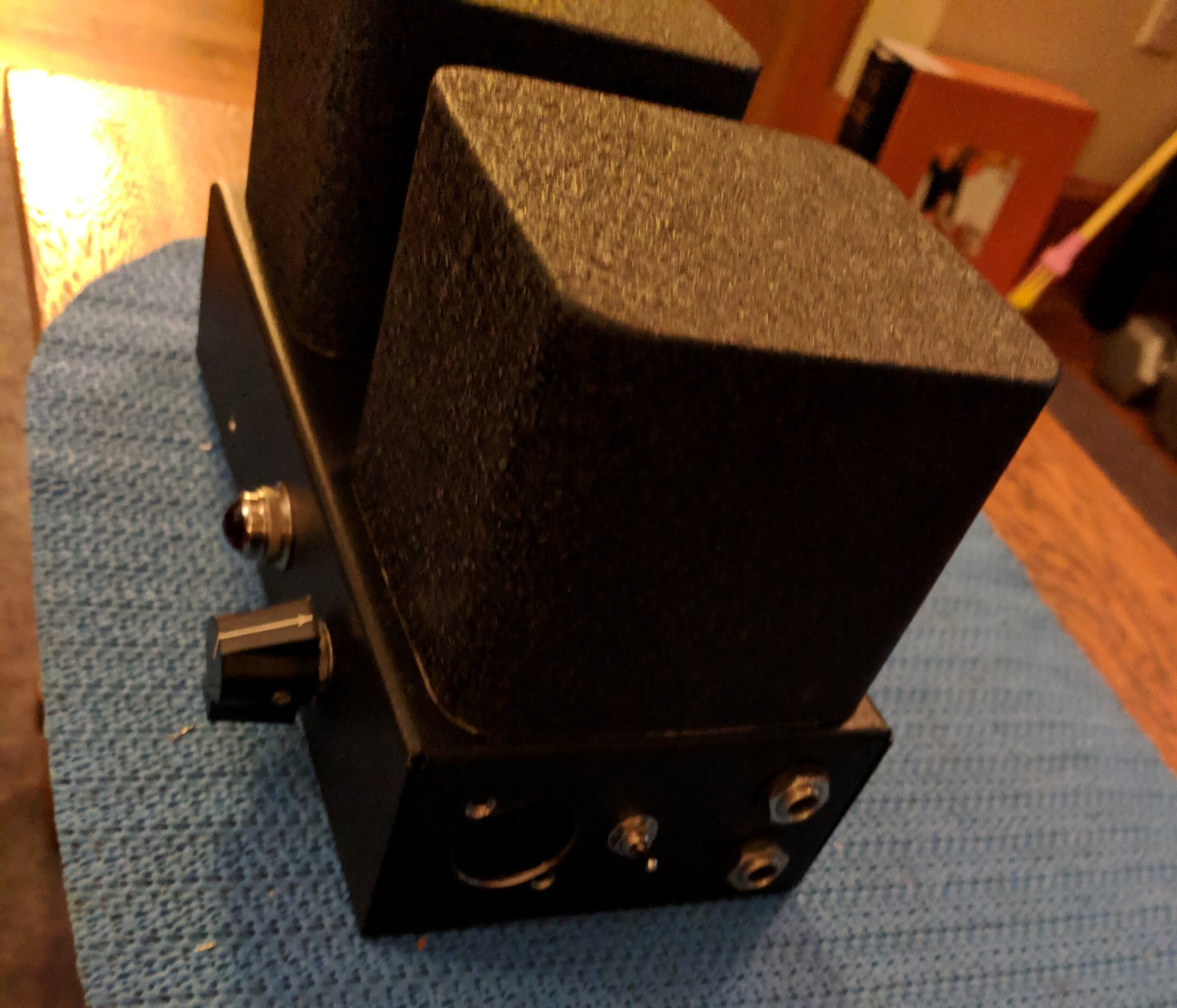 Not only were the transformers mounted off-axis, shields were built to block magnetic coupling. The steel cans were mounted over the transformers, lined with adhesive backed mu-metal shielding.