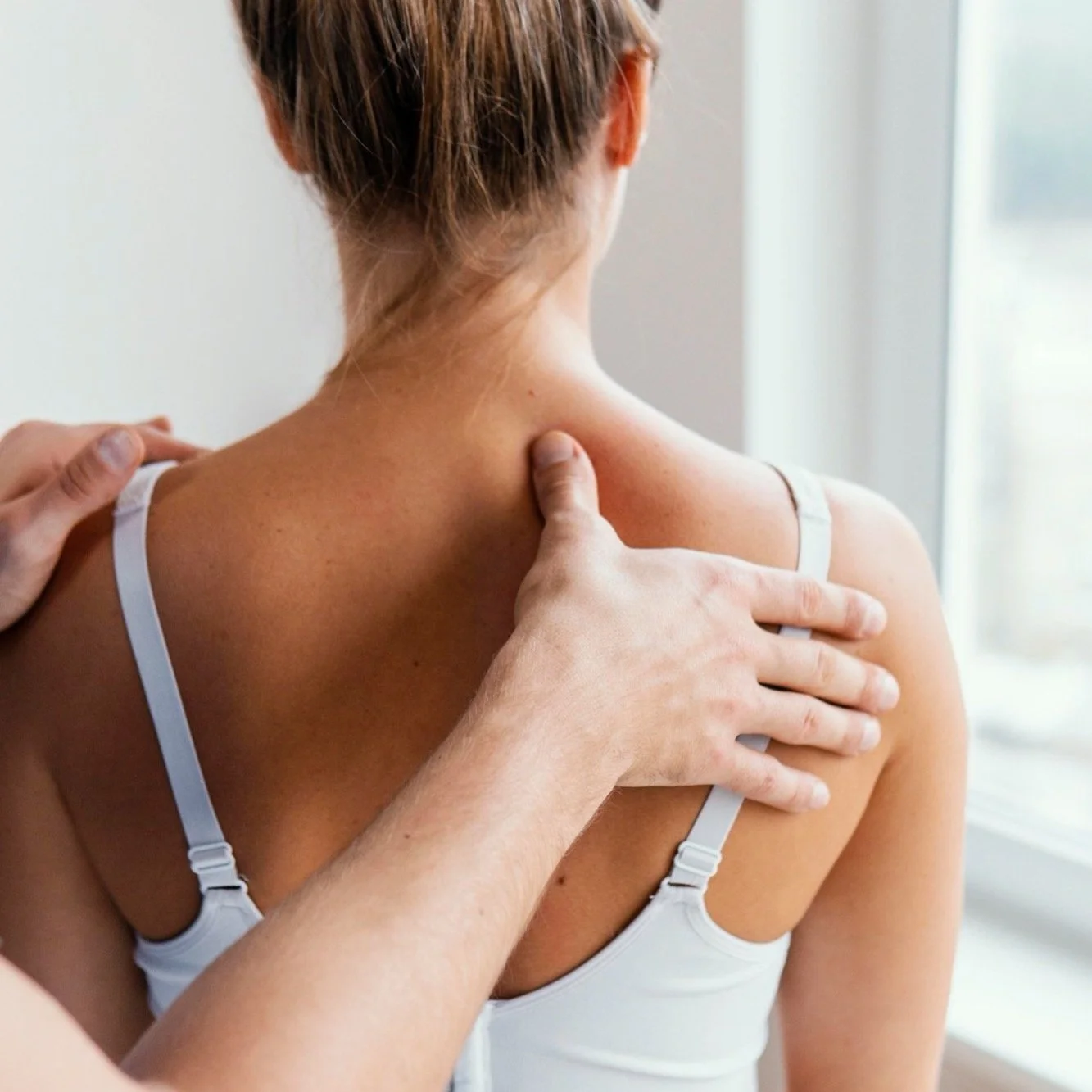 male-osteopathic-therapist-checking-female-patient-s-upper-spine.jpg