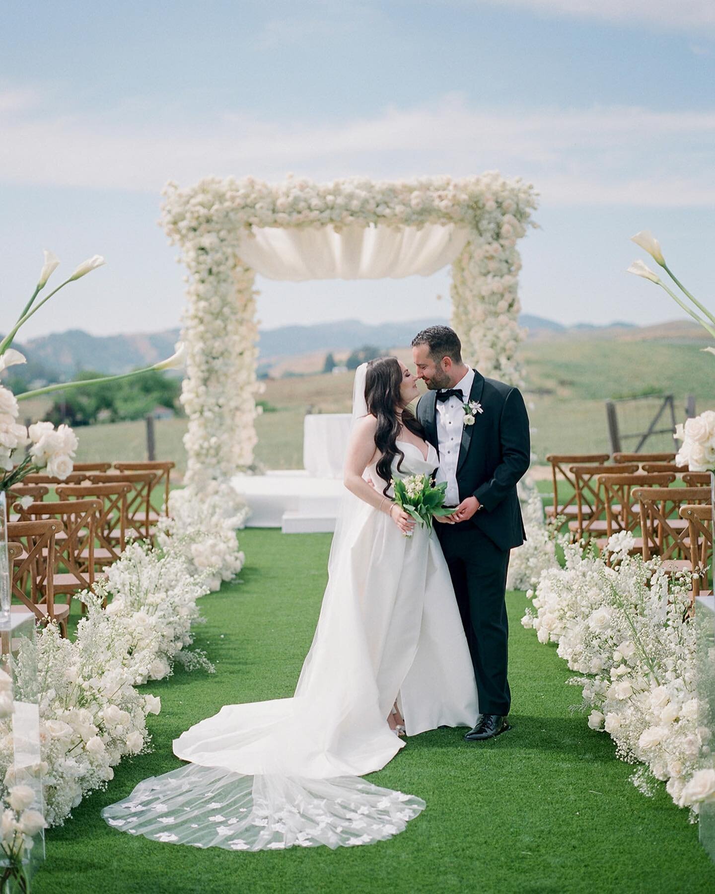 Lost in a dream of elegance and serenity, we celebrate love in Napa Valley, where breathtaking views painted the perfect backdrop. They exchanged vows under a magnificent canopy of all white flowers, creating a fairytale-like atmosphere.

Planning + 