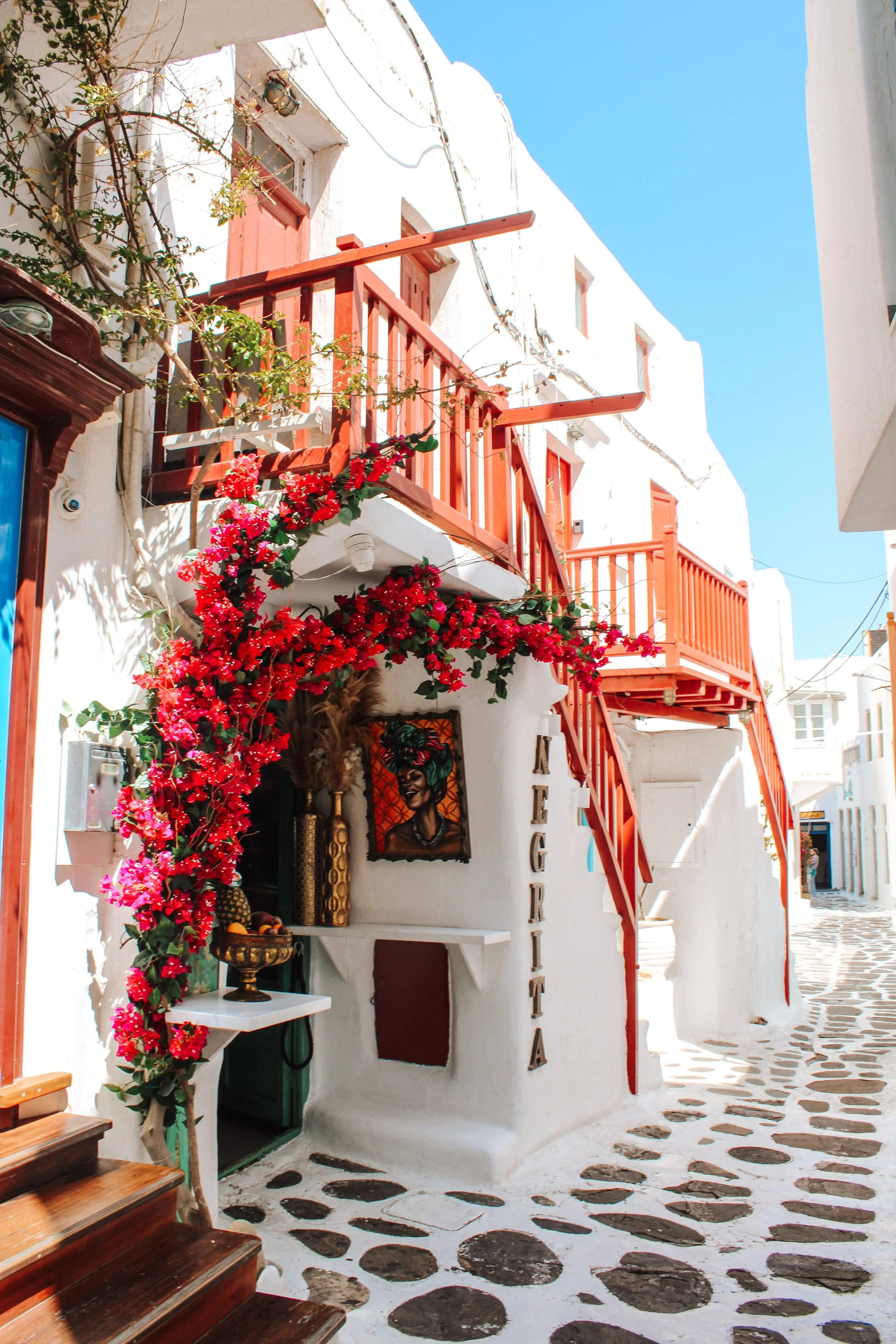 Bougainvillea and whitewashed buildings in Mykonos Town