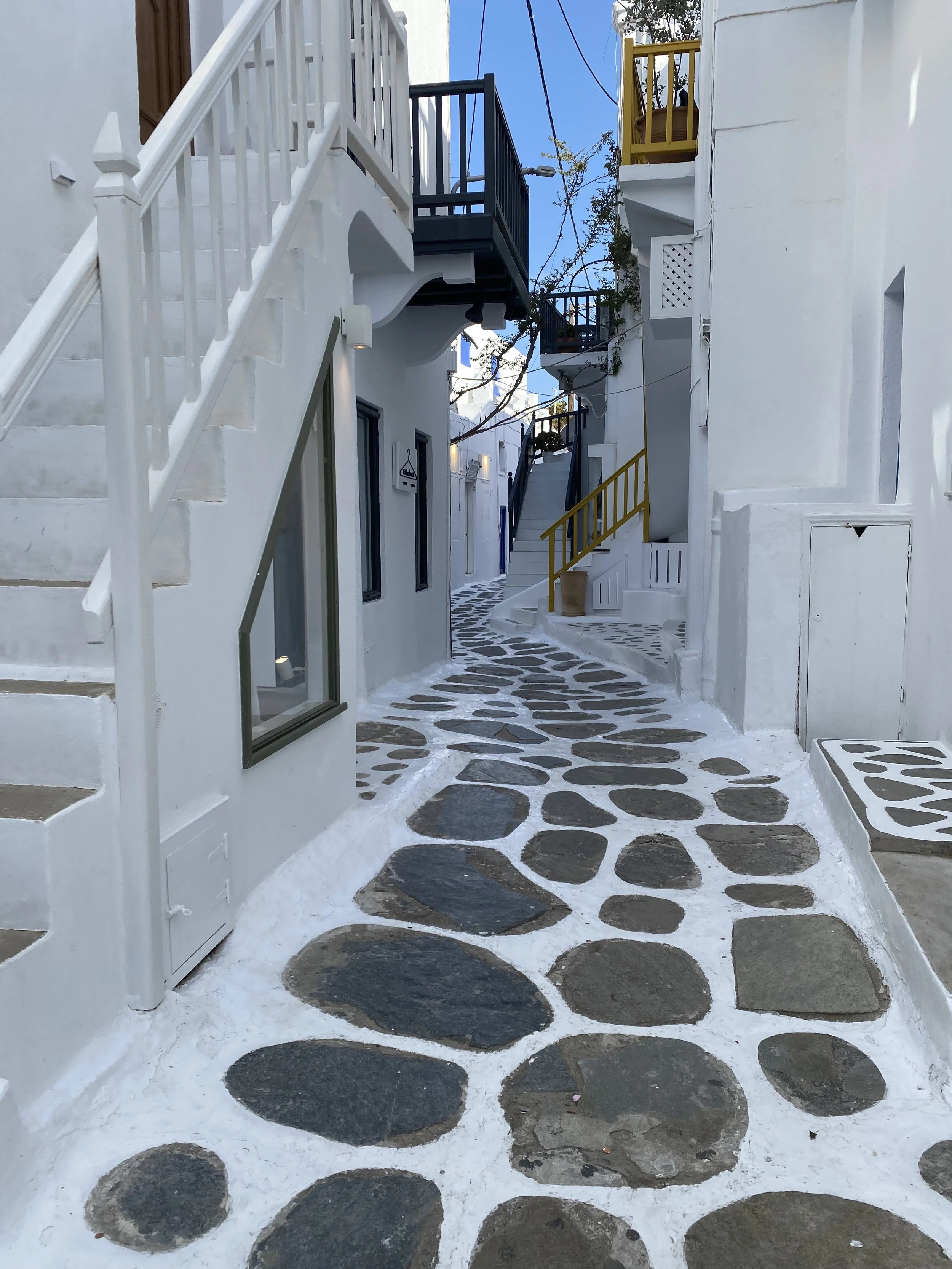 Whitewashed streets and traditional buildings in Mykonos Town Greece