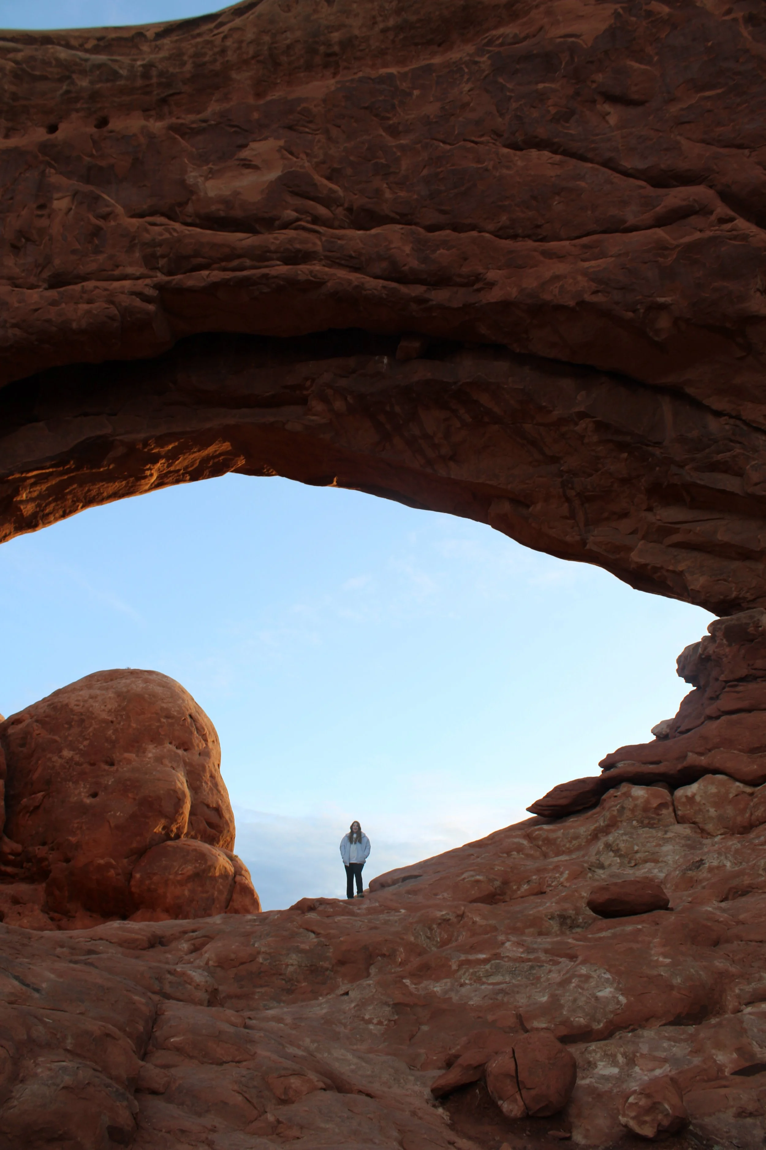 Posing in front of rock formation in Arches National Park