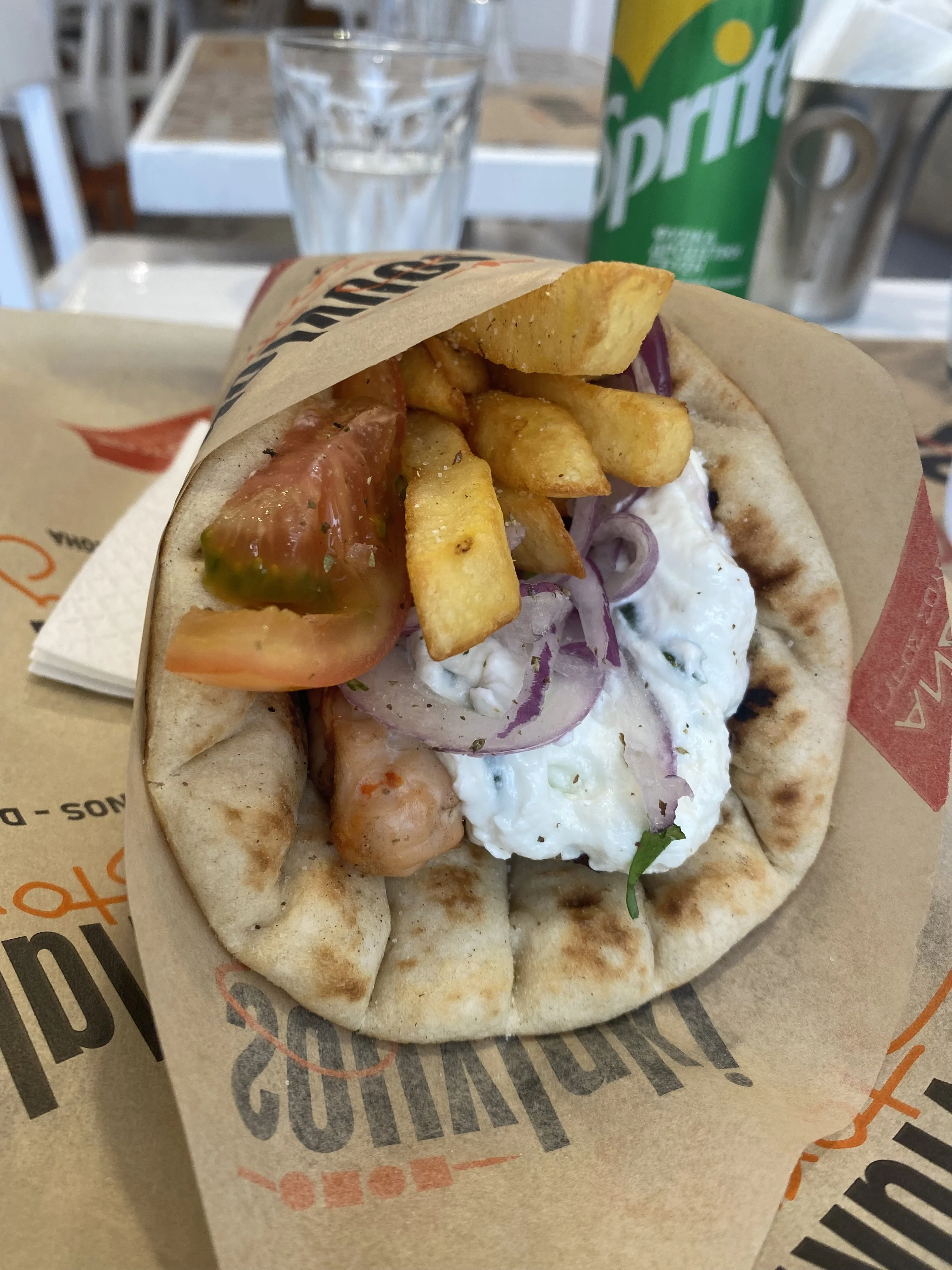 No trip to Mykonos is complete without stopping for a classic gyro on the go — I'd grab one anytime I needed a quick bite between exploring.
