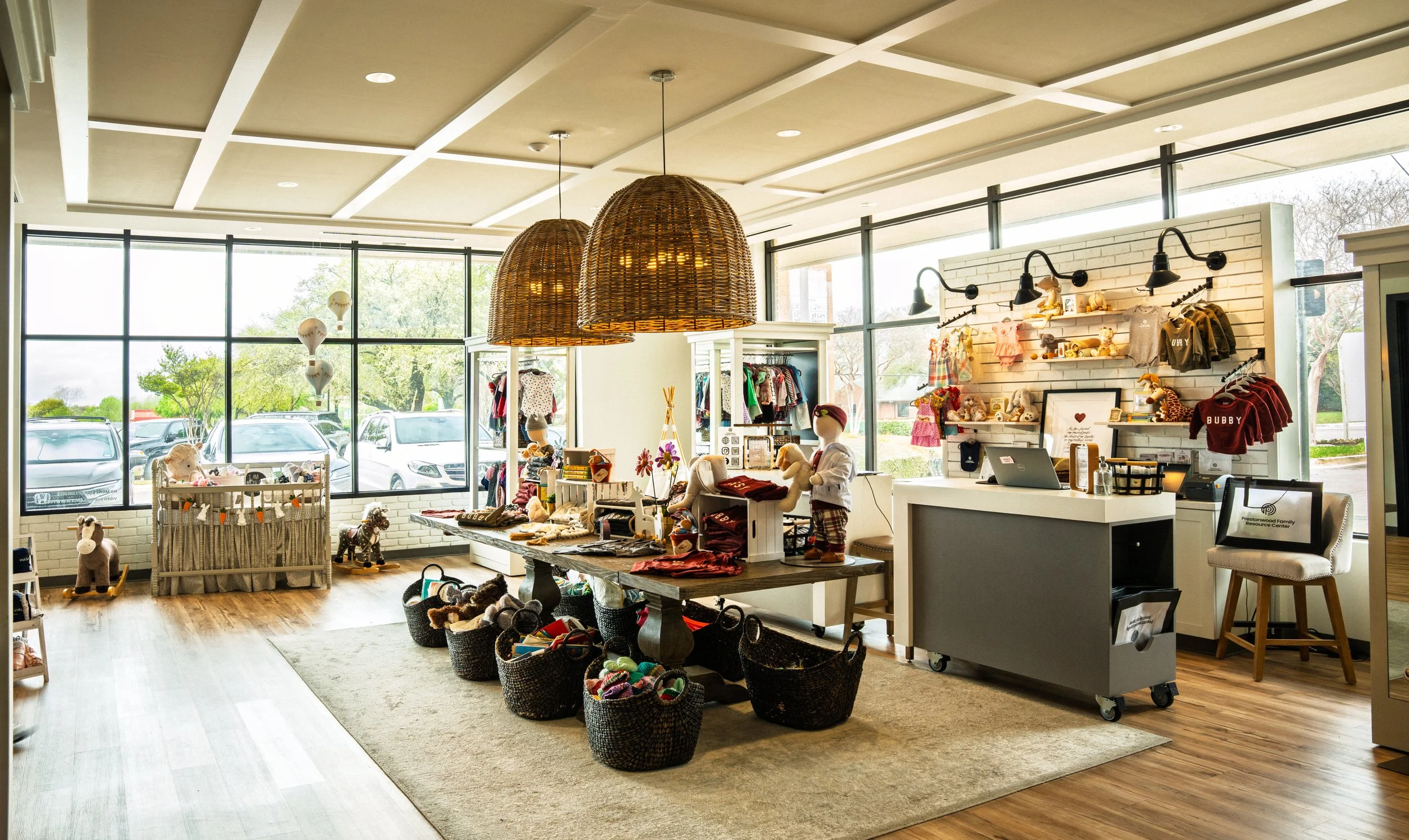 This family resource center is a service of the Prestonwood Pregnancy Center. We designed a flexible, multipurpose space for a baby boutique ‘store’ with a large classroom, video production studio, offices, and high density storage for this active m