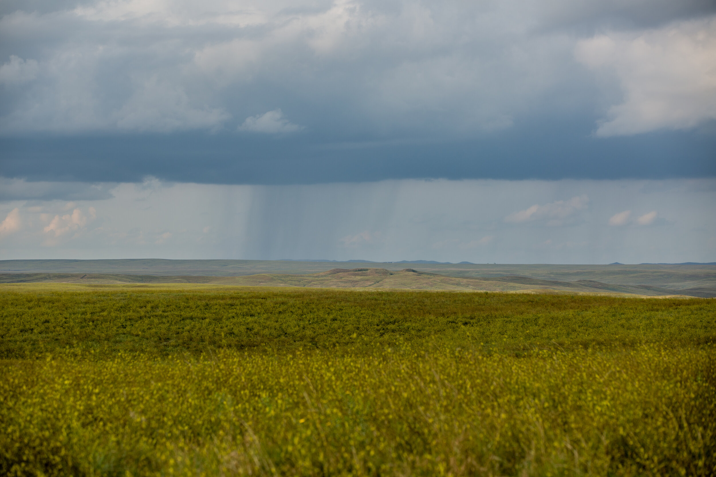 Rain Showers over Scatter Butte on the DX Ranch, Scatter Butte holds sacred meaning for my Lakota Sioux ancesters and it is where we spread my grandfather's ashes.jpg