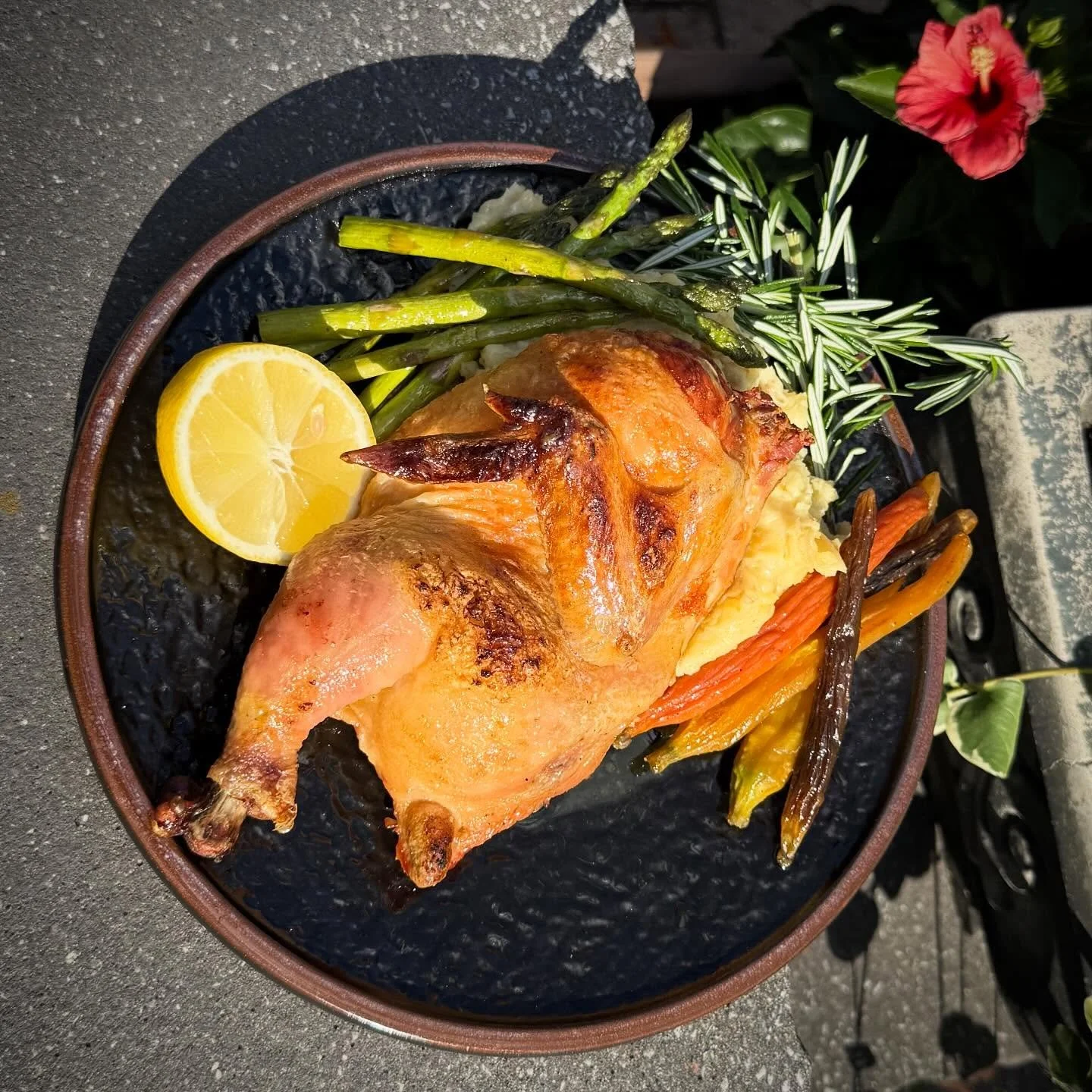 Half Roasted Chicken- 16-ounce half chicken roasted to perfection with brown butter and rosemary. Served over a creamy golden Yukon potato puree, complemented by grilled asparagus and tri-color carrots