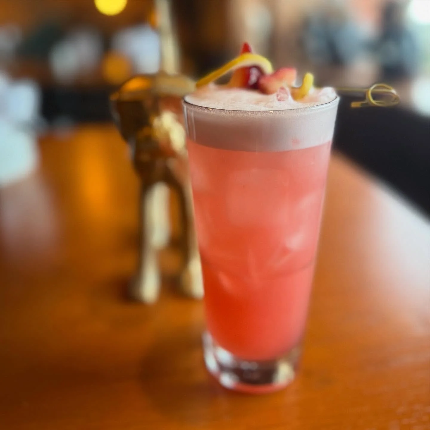 Yuzu Layover - A bright and refreshing escape featuring our house-infused strawberry lemongrass vodka, ginger liqueur, yuzu liqueur, lemon, lime, and fresh strawberry