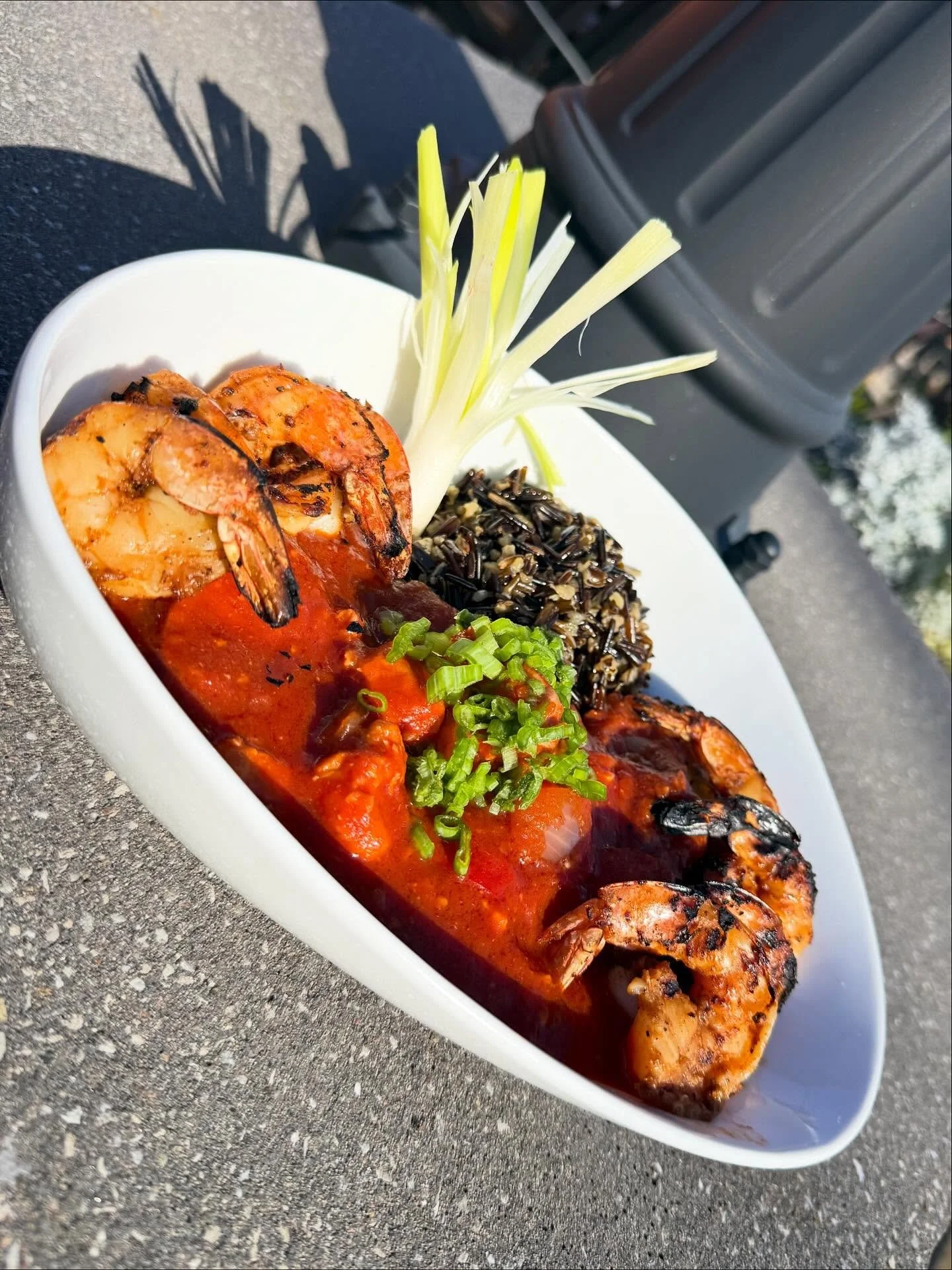 Juliet Jambalaya- A hearty New Orleans-style jambalava loaded with tender chicken thighs, smoky andouille sausage, and jumbo shrimp immered in a bold Creole tomato sauce with peppers, onions, and spices. Served over black wild rice