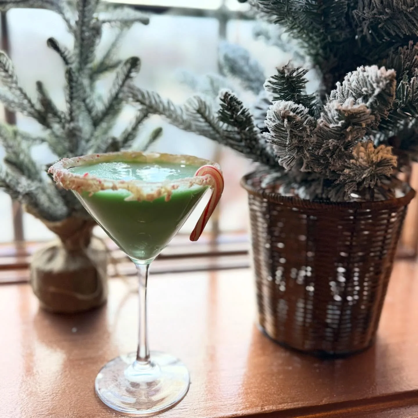 Meet The Grinchtini - A holiday mischief-maker shaken with vanilla &amp; chocolate vodka, RumChata, cr&egrave;me de menthe, and a splash of festive eggnog