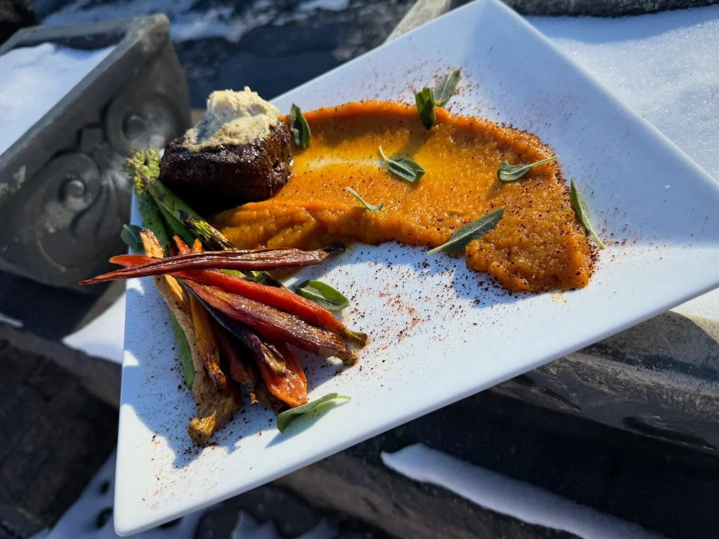 Red Eye Filet- 8 oz center cut filet grilled with our house Cajun espresso rub, served over spiced butternut puree, finished with garlic herb butter, tri color maple roasted carrots and grilled asparagus