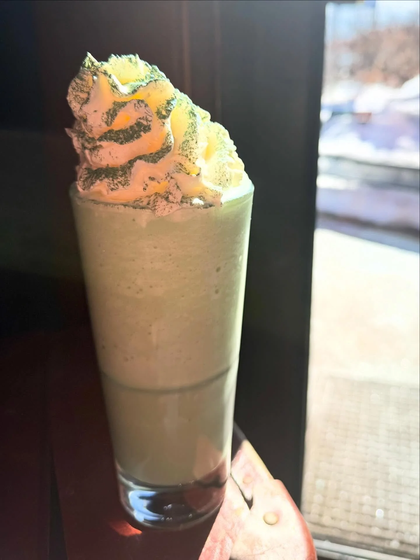 Shamrock Shake cocktail- blends smooth vanilla ice cream with rich Irish cream liqueur, vanilla vodka, and vibrant cr&egrave;me de menthe for that bold green glow, topped with fluffy whipped cream for a shamrock-worthy finish 💚