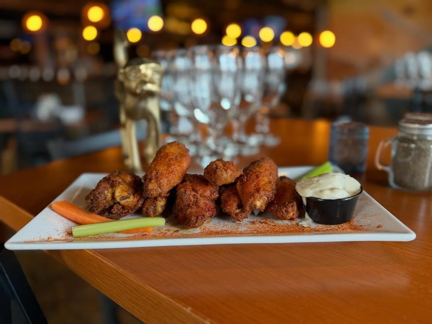 Bravo Bufallo Dry Rub Wings- No Monkey-ing around with these jumbo wings. Baked in our secret monkey rub, then fried crispy. Tossed with a house-made burgle dry rub, served with carrots, celery and blue cheese dressing