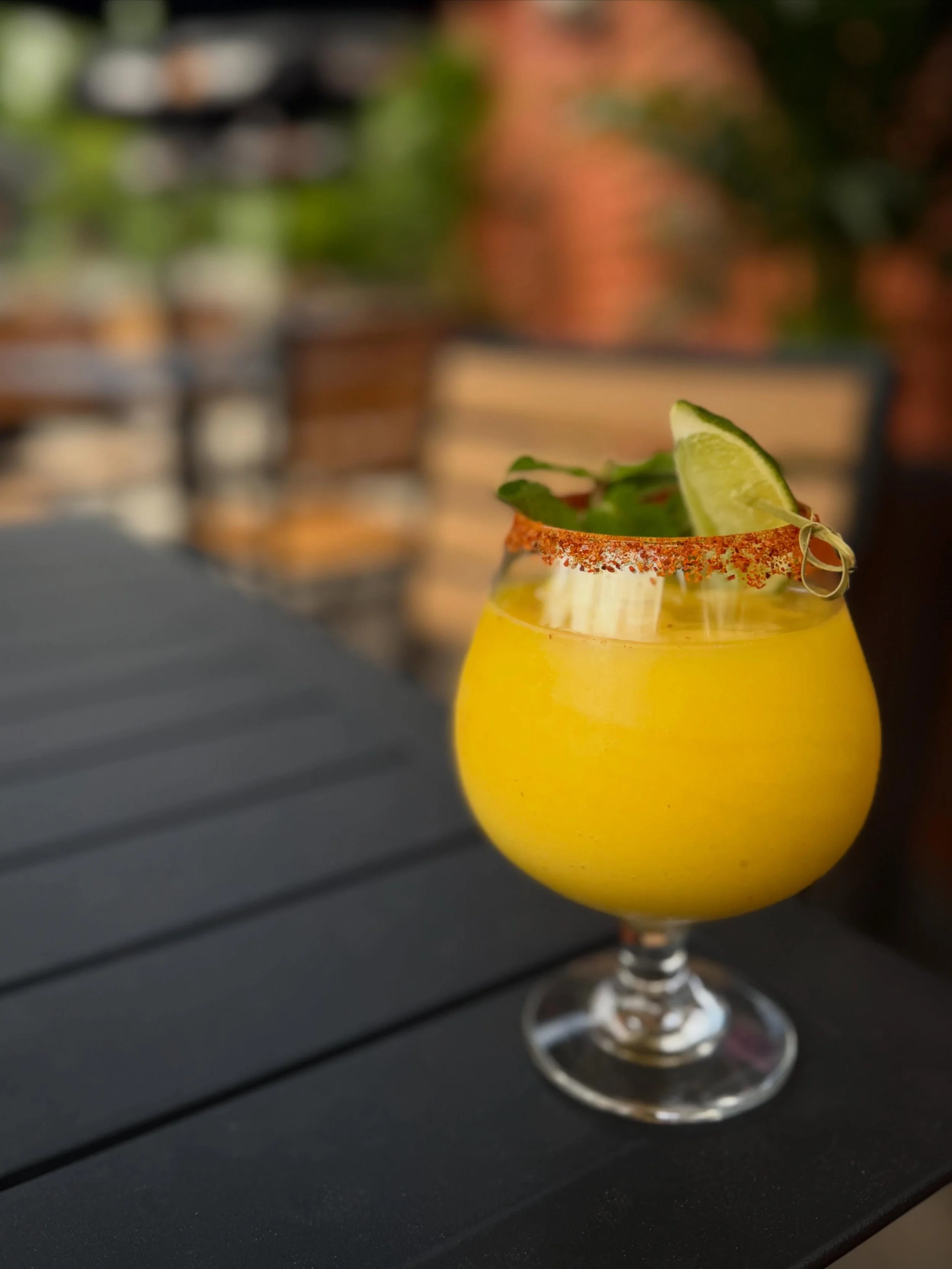 Spicy Mango Freeze 🌶️🥭 Made with house-infused jalape&ntilde;o tequila, orange liqueur, freshly scooped mango sorbet, and fresh mango juice for the perfect mix of sweet, spicy, and icy smooth.