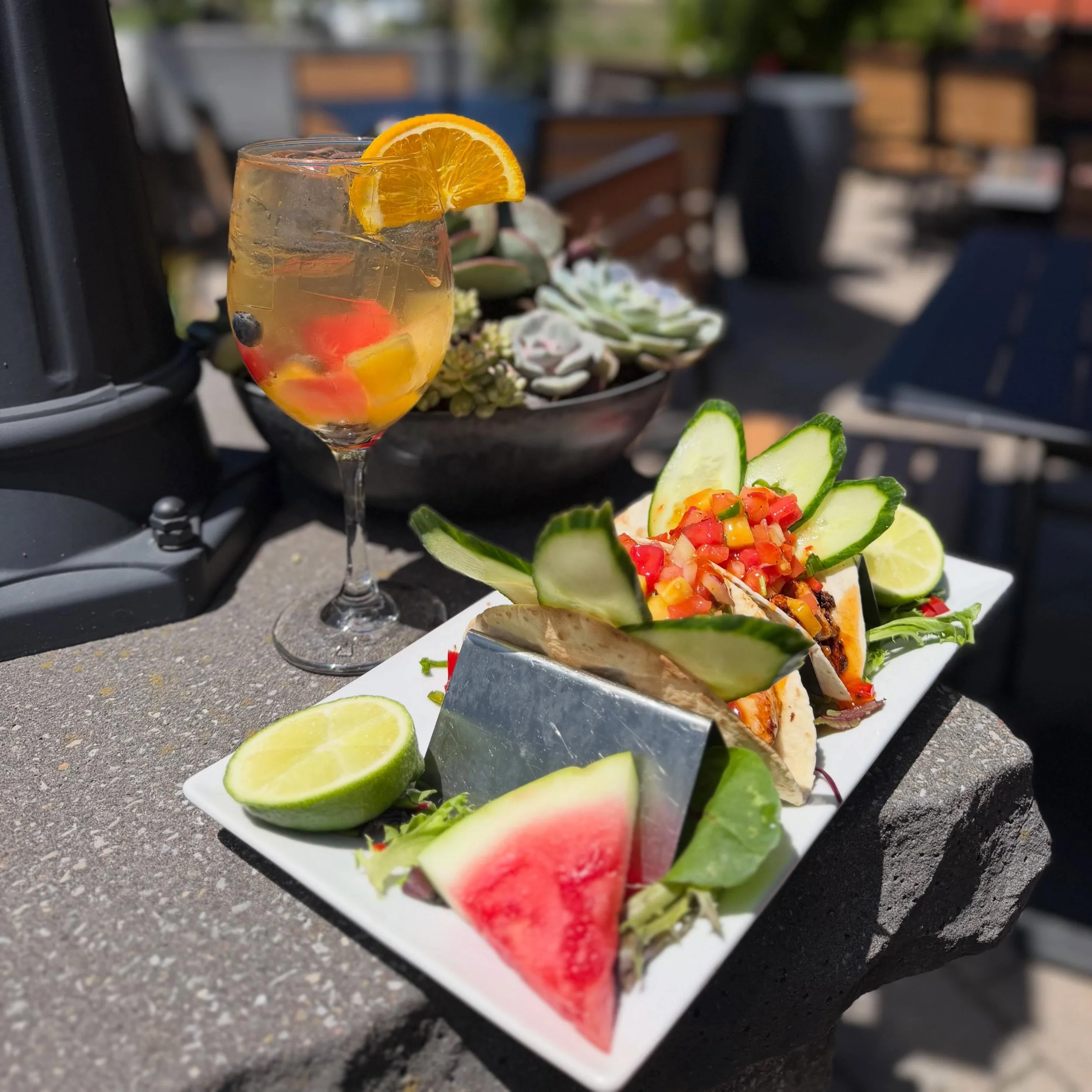 Patio season is officially here! 

Join us outdoors and sip into summer with our Fresh Fruit Salad Sangria &mdash; a refreshing blend of house-made fresh fruit salad, peach liqueur, orange liqueur, and crisp Pinot Grigio. 

Pair it with our Watermelo