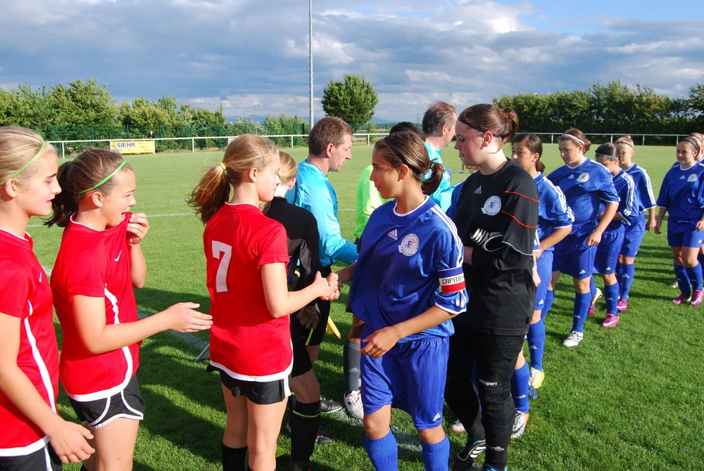 College soccer team playing a friendly fixture abroad