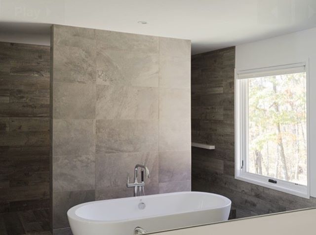 Tub reflected in mirror - house in Pawling .
.
.
#bathroom #bathtub #tile #house  #modernfarmhouse #modernism #zen #simple #light #porcelain #pawling #design