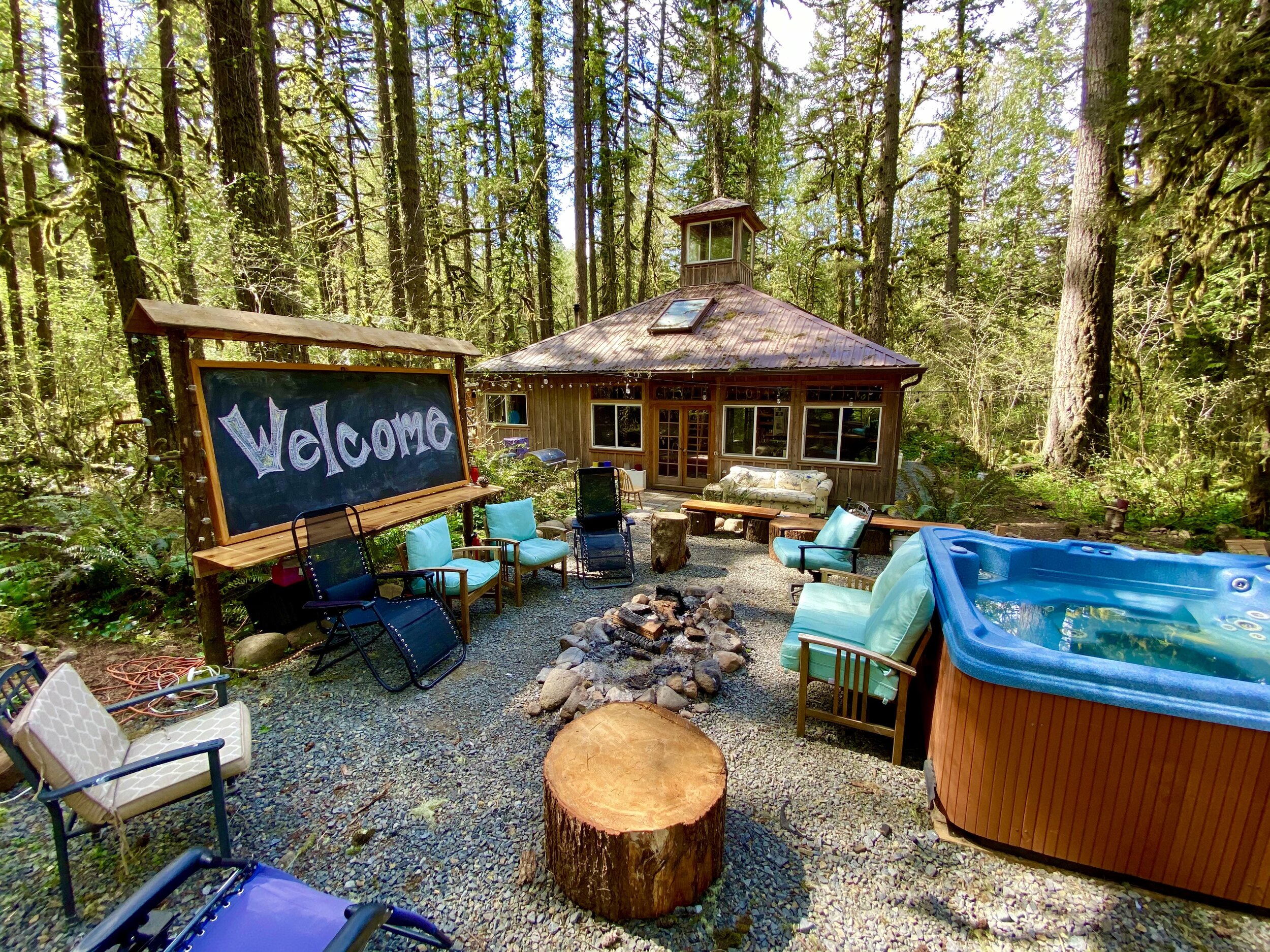 lodge ext back welcome sign + hot tub.jpg